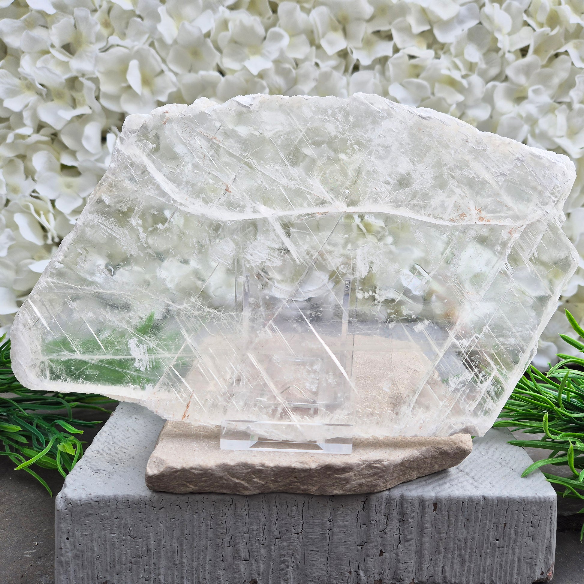 Gypsum crystal transparent window plate from Mexico, used for cleansing and charging crystals or jewellery. Includes clear acrylic stand. 