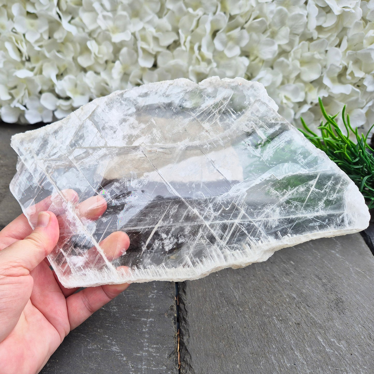 Gypsum crystal transparent window plate from Mexico, used for cleansing and charging crystals or jewellery. Includes clear acrylic stand. 
