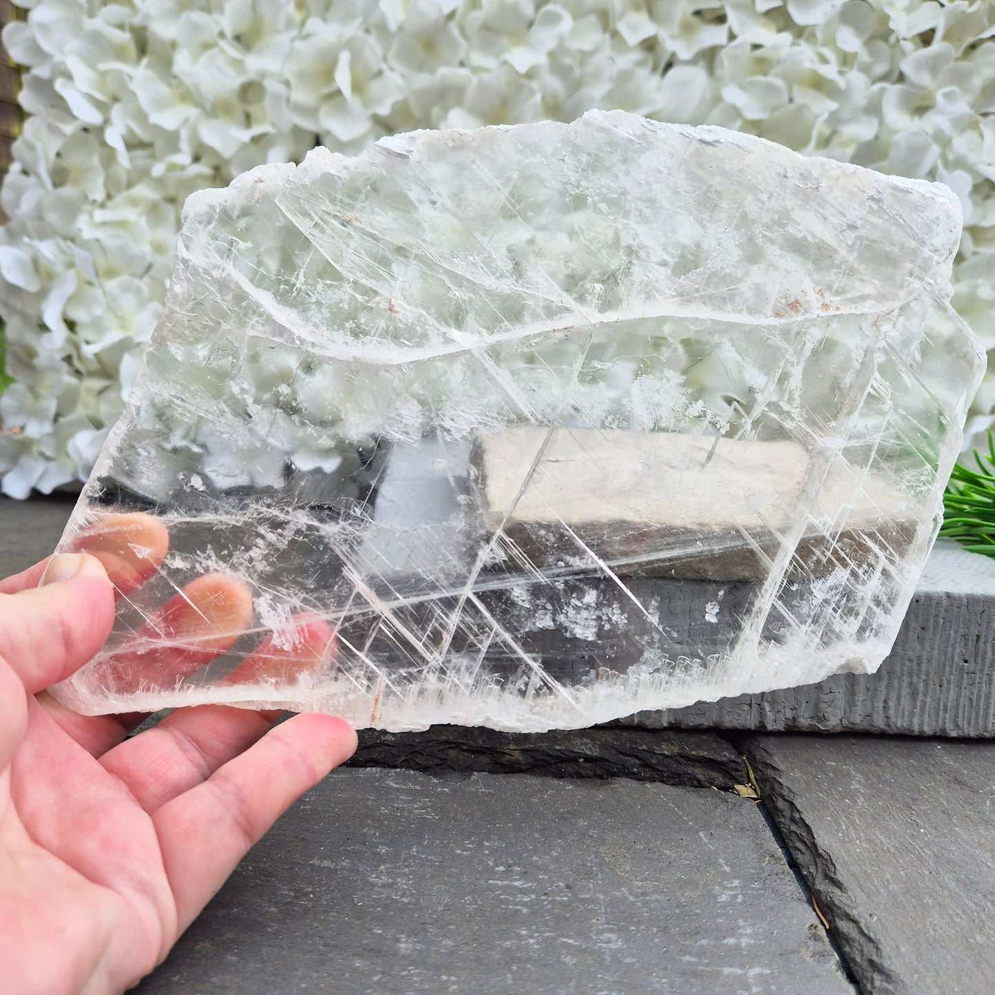 Gypsum crystal transparent window plate from Mexico, used for cleansing and charging crystals or jewellery. Includes clear acrylic stand. 