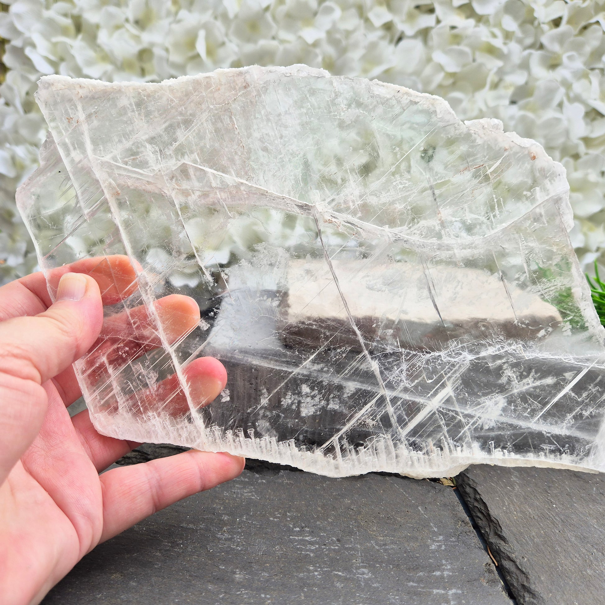 Gypsum crystal transparent window plate from Mexico, used for cleansing and charging crystals or jewellery. Includes clear acrylic stand. 