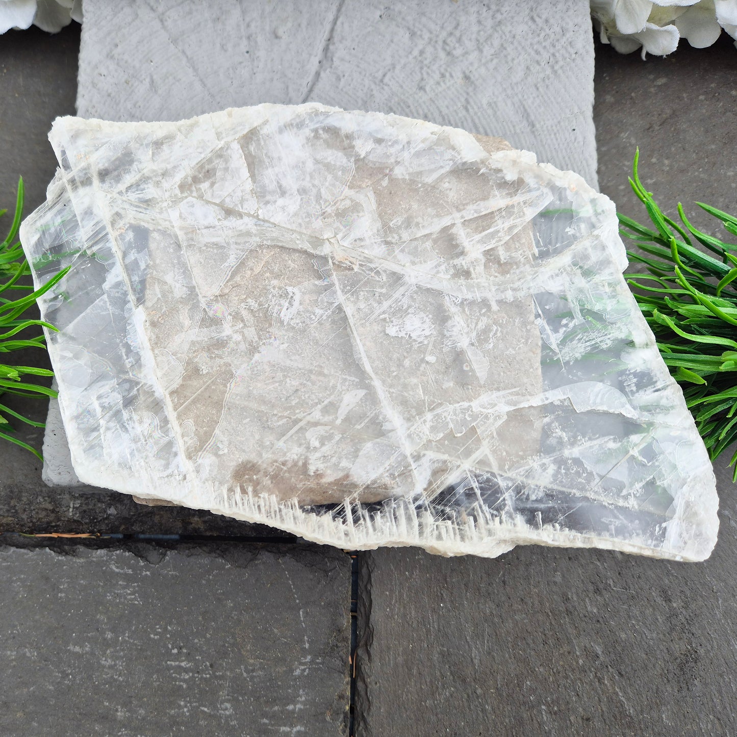 Gypsum crystal transparent window plate from Mexico, used for cleansing and charging crystals or jewellery. Includes clear acrylic stand. 