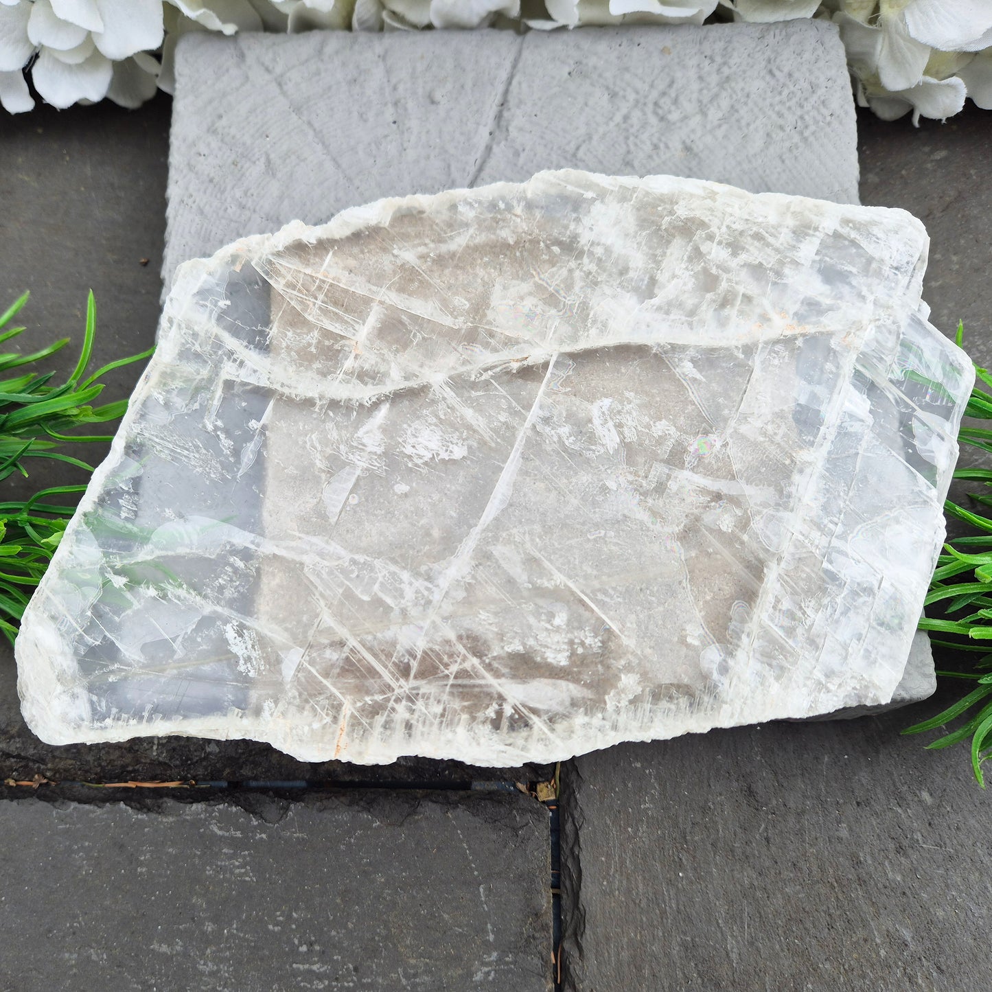 Gypsum crystal transparent window plate from Mexico, used for cleansing and charging crystals or jewellery. Includes clear acrylic stand. 