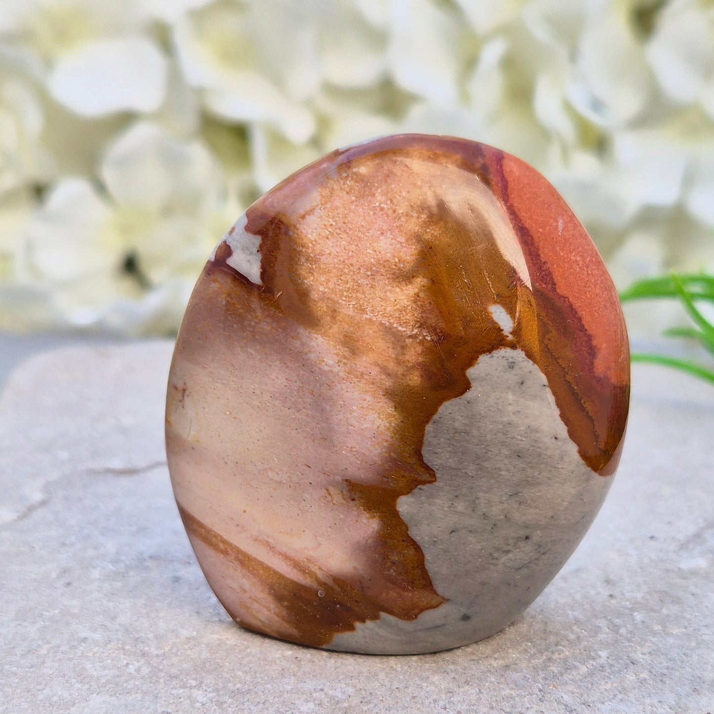 Polychrome Jasper polished freeform from Madagascar with warm earthy colours. A grounding crystal for stability, presence, and steady energy.