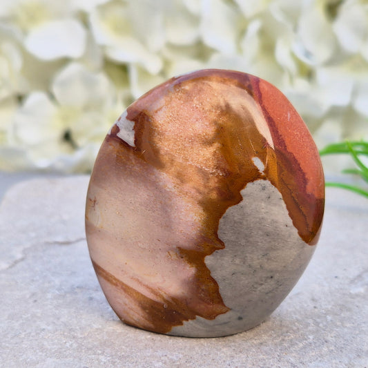 Polychrome Jasper polished freeform from Madagascar with warm earthy colours. A grounding crystal for stability, presence, and steady energy.