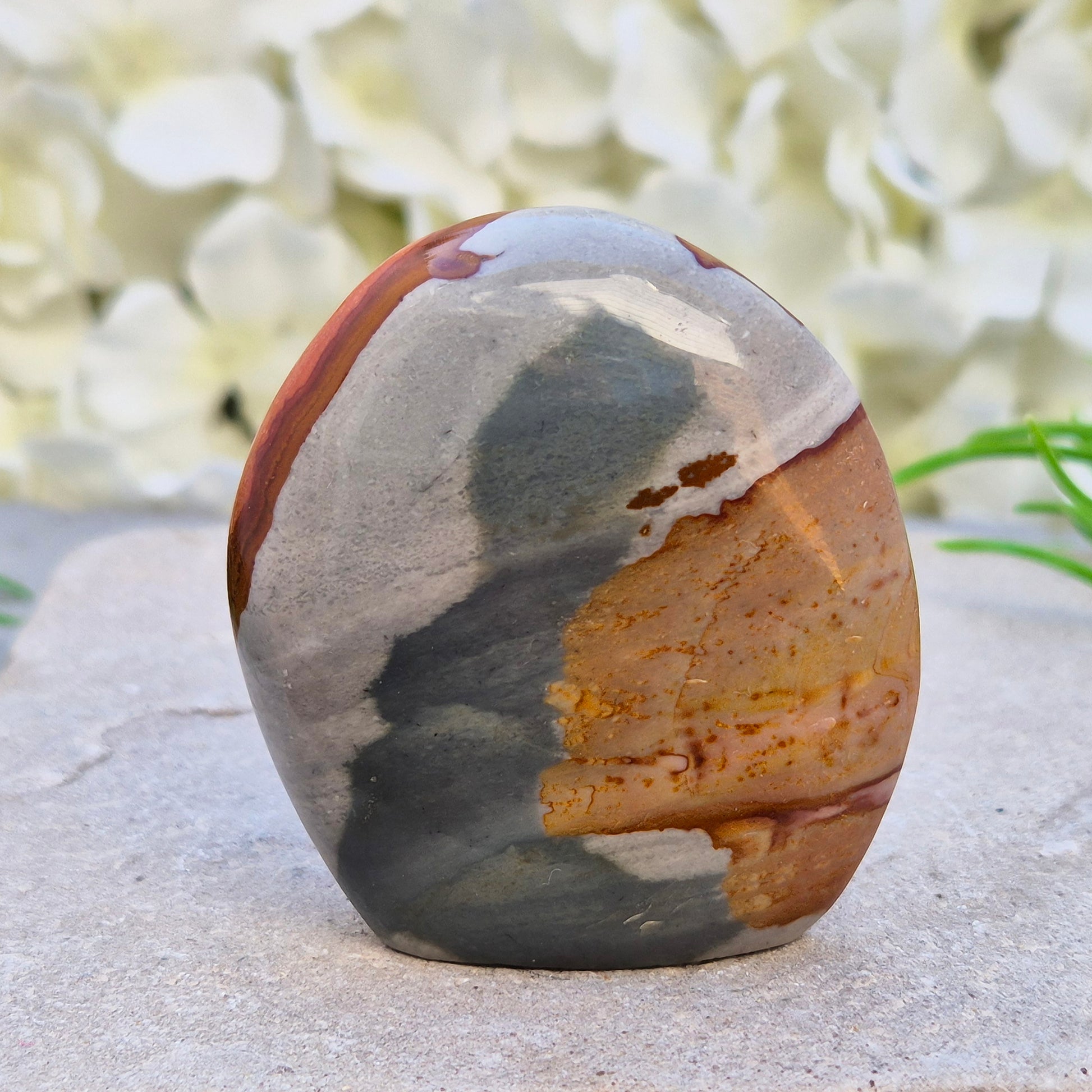 Polychrome Jasper polished freeform from Madagascar with warm earthy colours. A grounding crystal for stability, presence, and steady energy.
