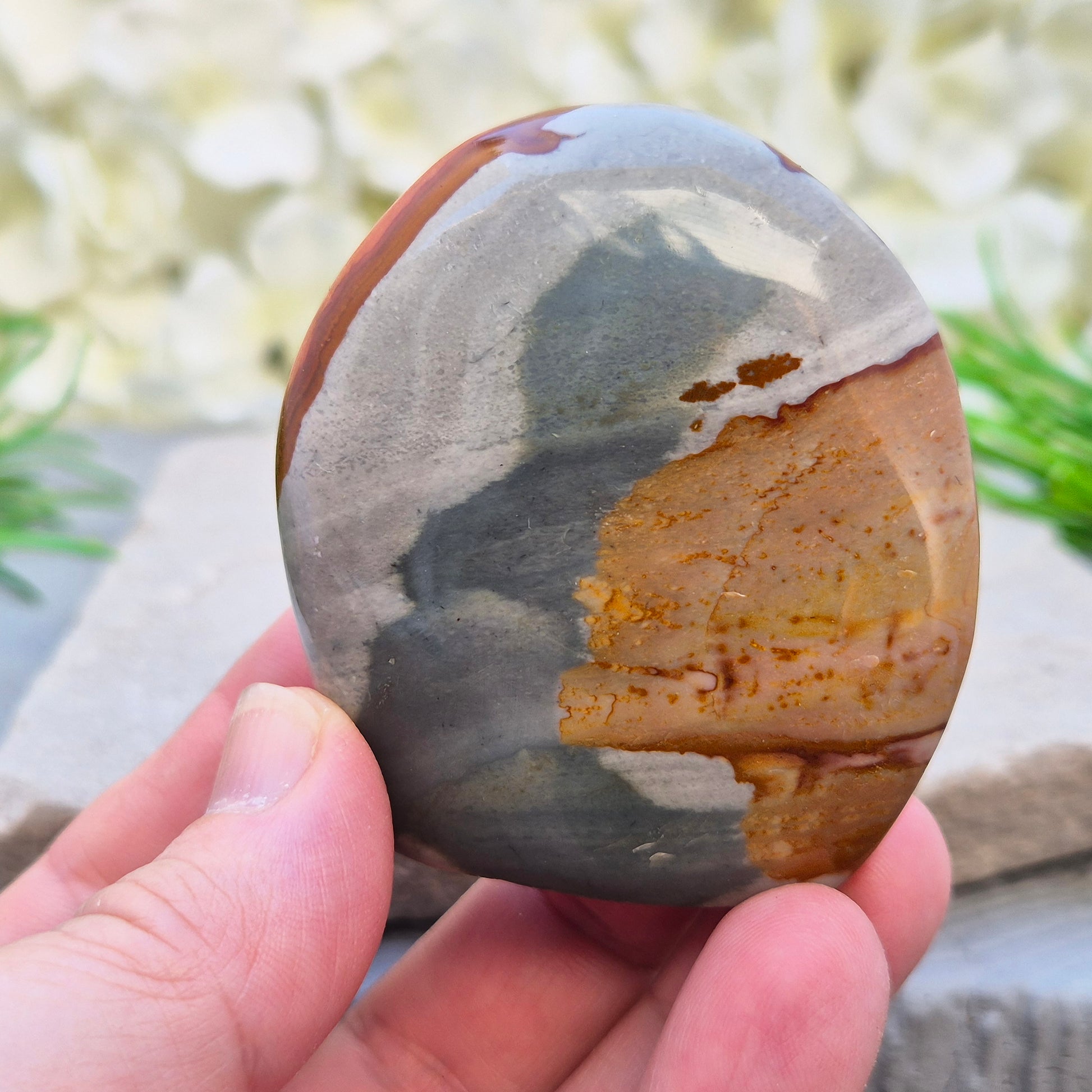 Polychrome Jasper polished freeform from Madagascar with warm earthy colours. A grounding crystal for stability, presence, and steady energy.