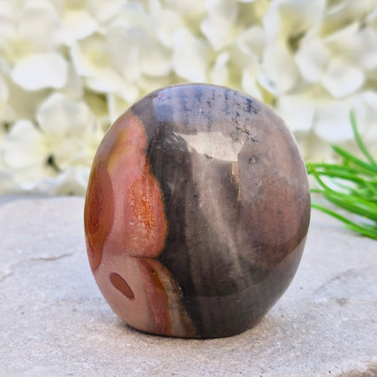 Polychrome Jasper freeform from Madagascar. Polished stone with earthy tones for grounding, stability, and balanced everyday energy.