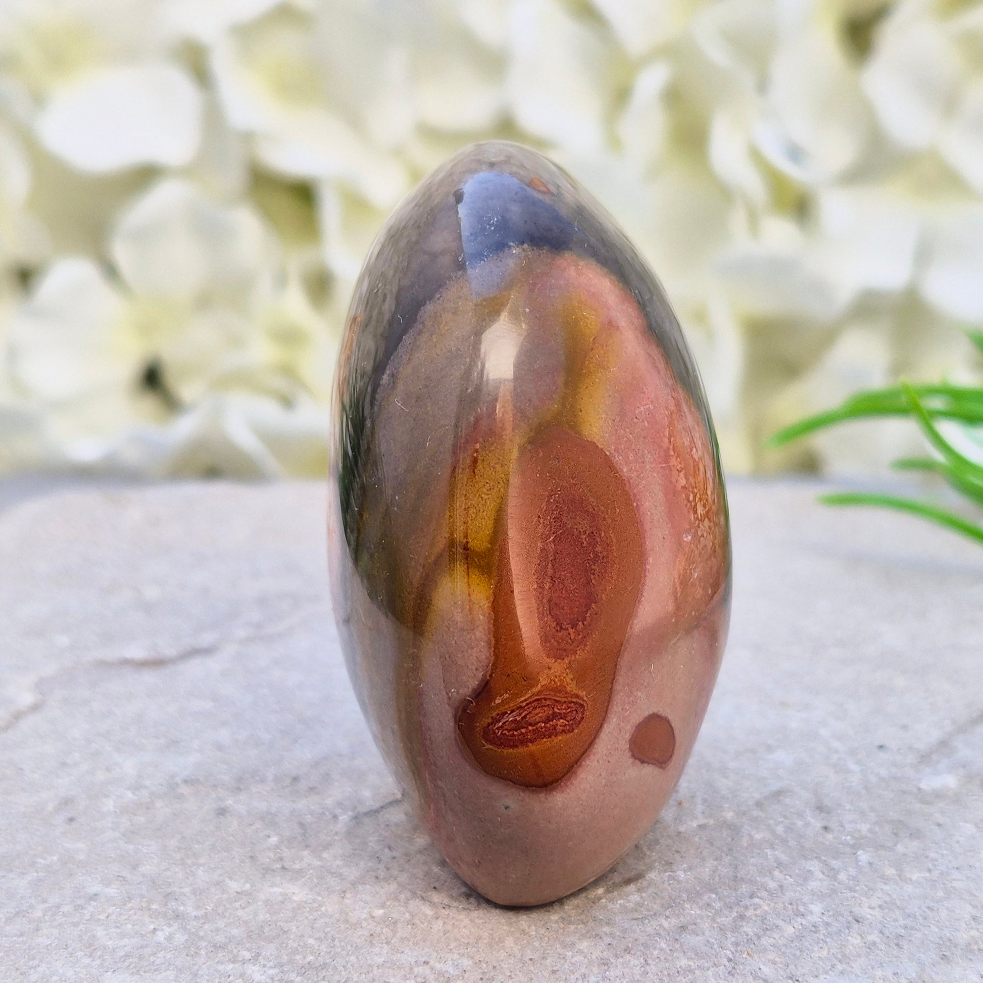 Polychrome Jasper freeform from Madagascar. Polished stone with earthy tones for grounding, stability, and balanced everyday energy.