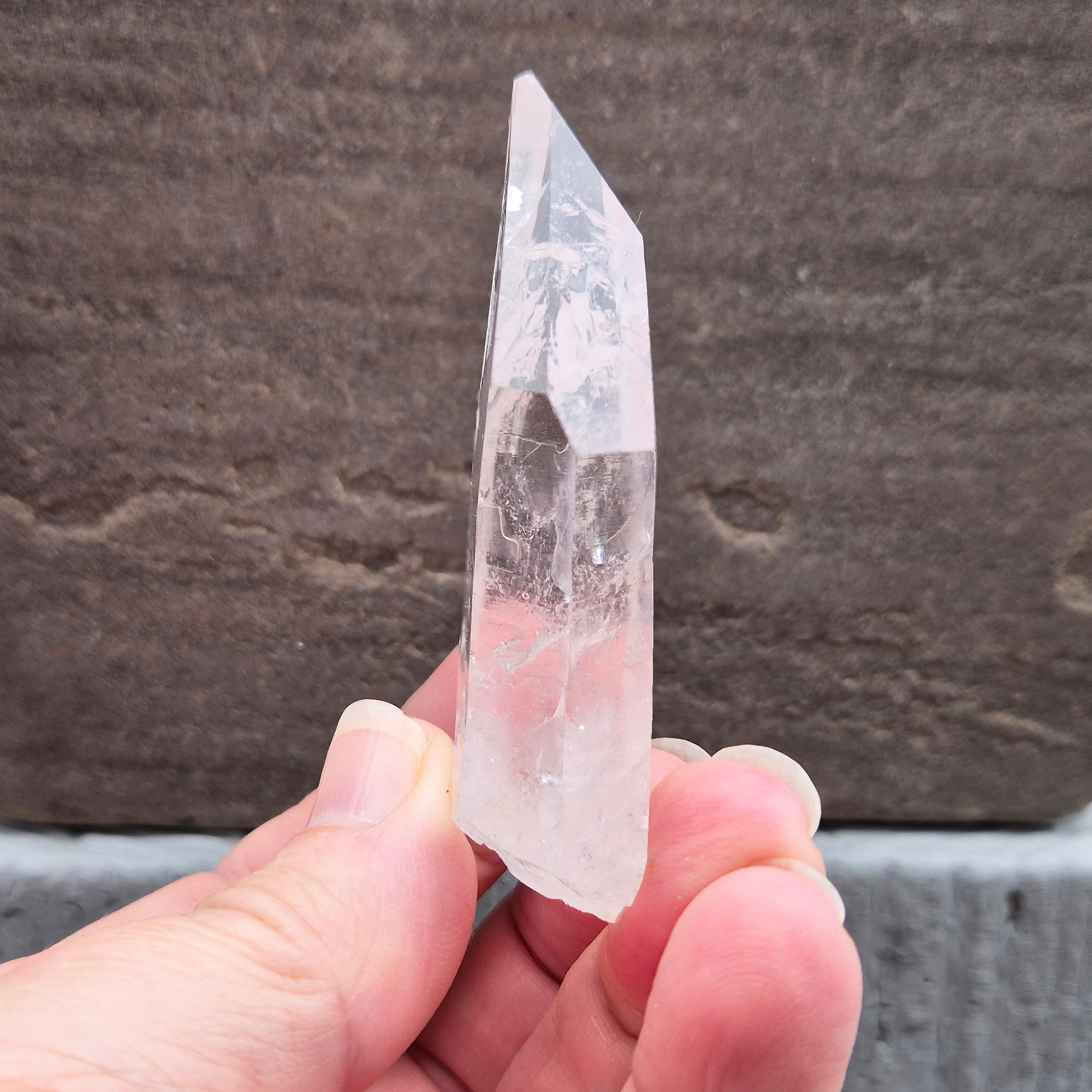 Natural Serra Quartz point from Brazil with clear, high-energy formation. Ideal for amplification, intention work, and focused spiritual practice.