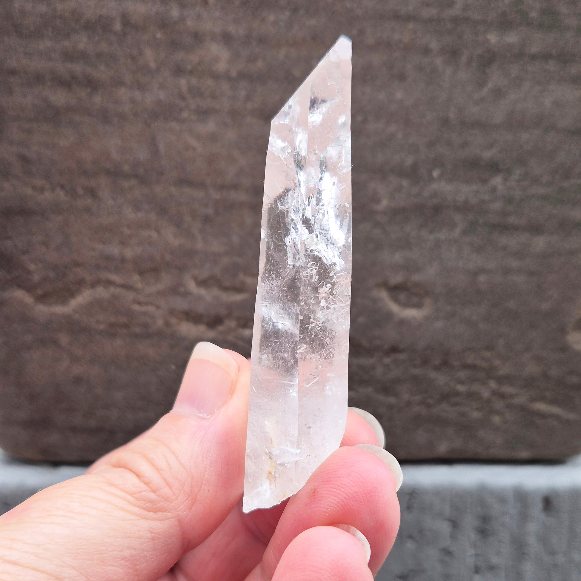 Natural Serra Quartz point from Brazil with clear, high-energy formation. Ideal for amplification, intention work, and focused spiritual practice.