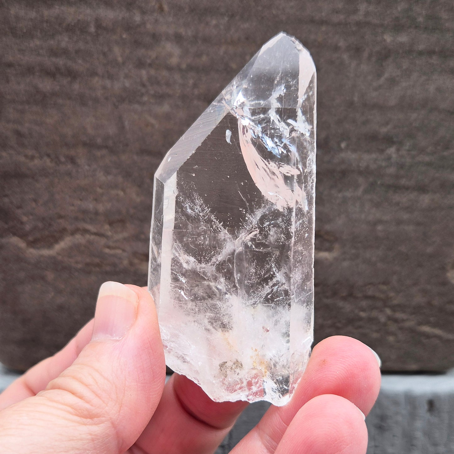 Natural Serra Quartz point from Brazil with clear, high-energy formation. Ideal for amplification, intention work, and focused spiritual practice.