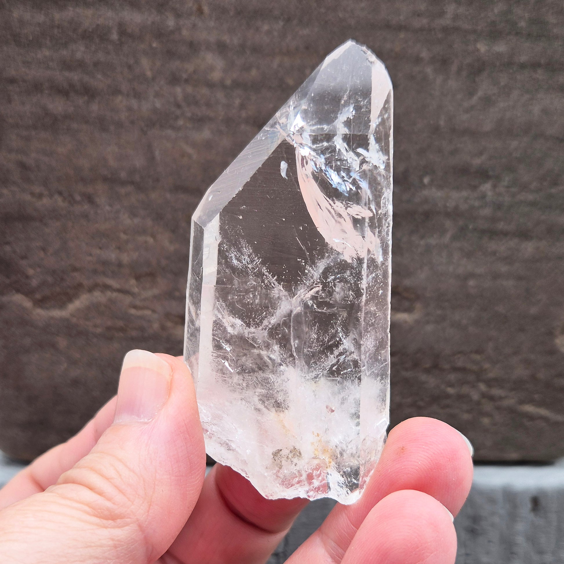 Natural Serra Quartz point from Brazil with clear, high-energy formation. Ideal for amplification, intention work, and focused spiritual practice.