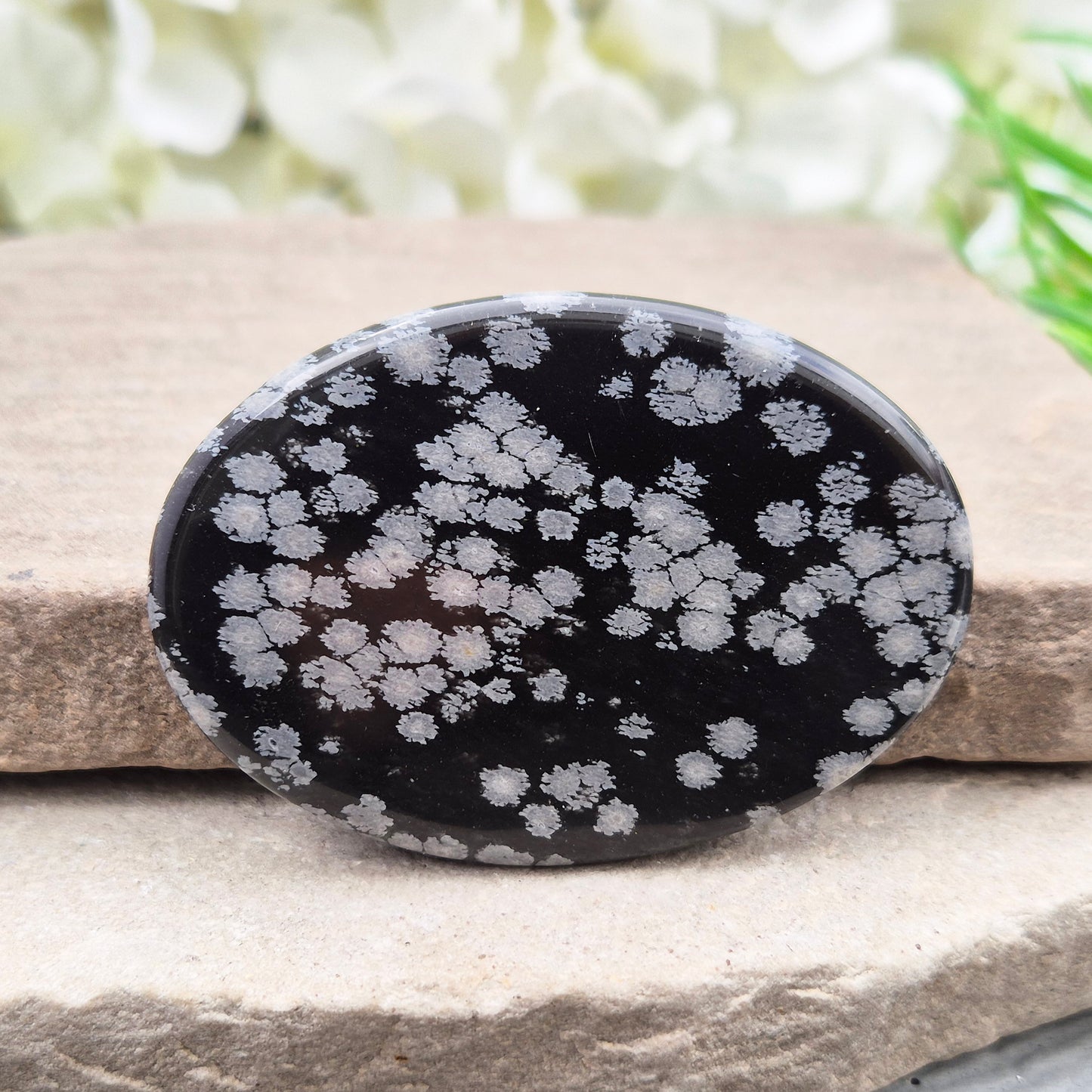 Natural Snowflake Obsidian Palm Stone – protective grounding crystal for releasing old patterns, emotional balance, and calm daily support.