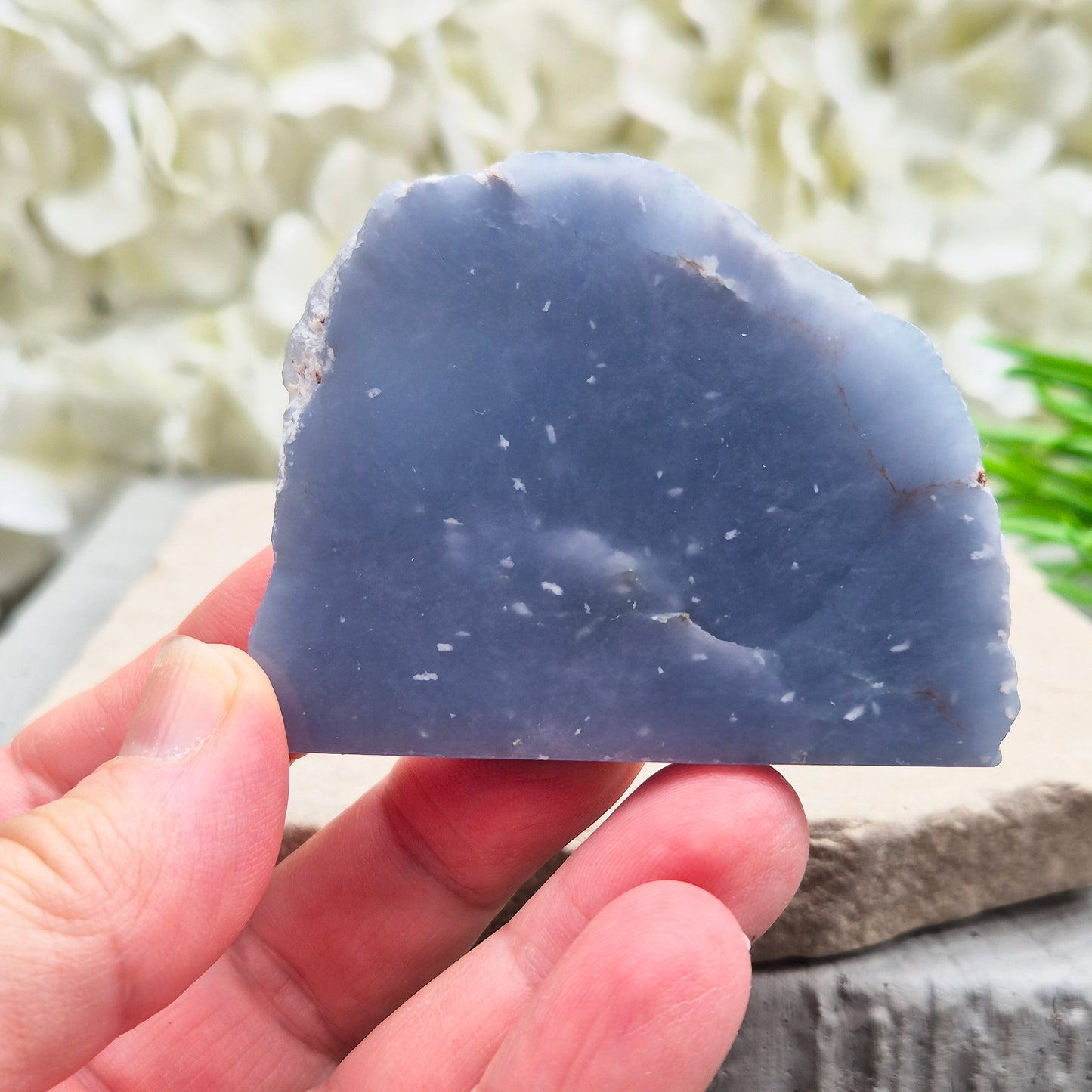 Natural Angelite polished standing freeform from Peru with soft blue tones and raw natural backing. A calming crystal for peaceful spaces.