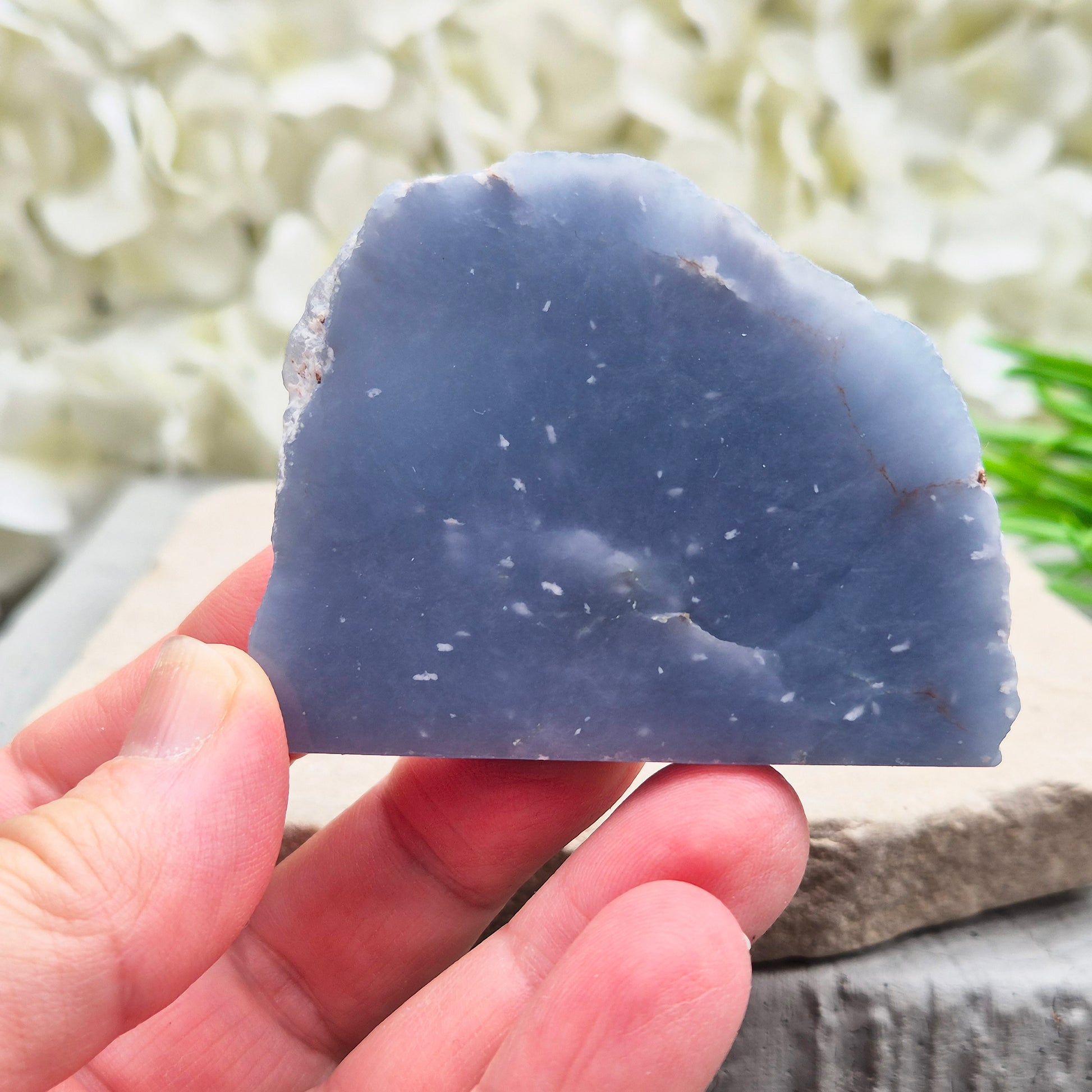 Natural Angelite polished standing freeform from Peru with soft blue tones and raw natural backing. A calming crystal for peaceful spaces.