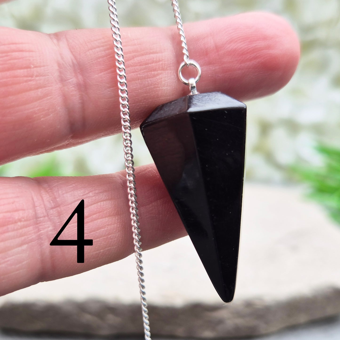 Natural Black Tourmaline crystal pendulum for dowsing, divination, and spiritual work. A grounding stone linked with protection and balance.
