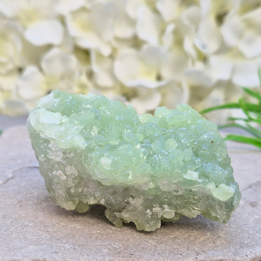 Natural Prehnite cluster from Mali with soft green tones and calming energy. A soothing crystal for emotional balance, rest, and peaceful spaces.