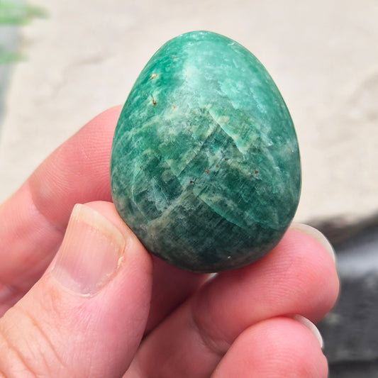 Polished Amazonite pebble shaped crystal with calming, balanced energy. Ideal for easing stress, open communication, and supportive everyday use.