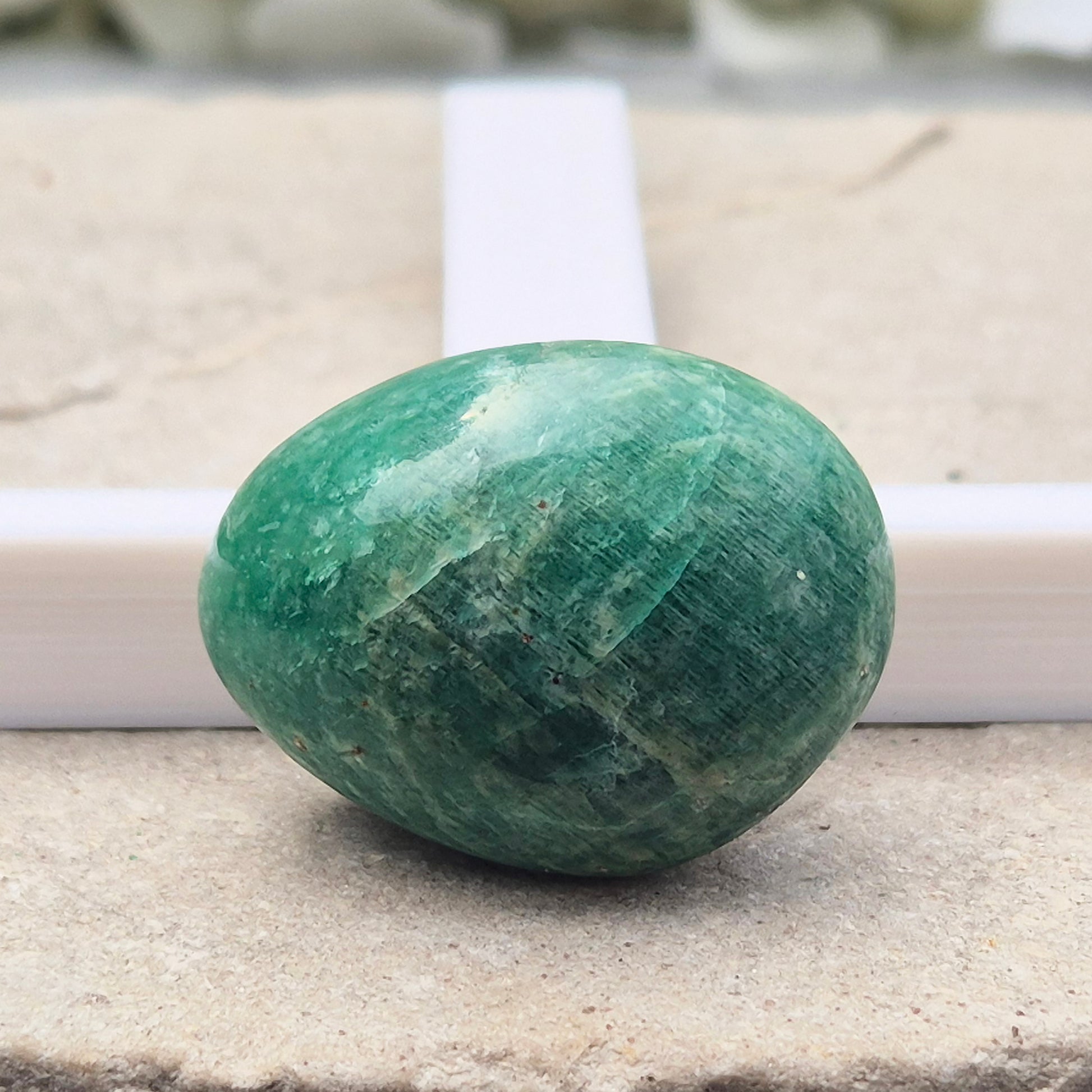 Polished Amazonite pebble shaped crystal with calming, balanced energy. Ideal for easing stress, open communication, and supportive everyday use.