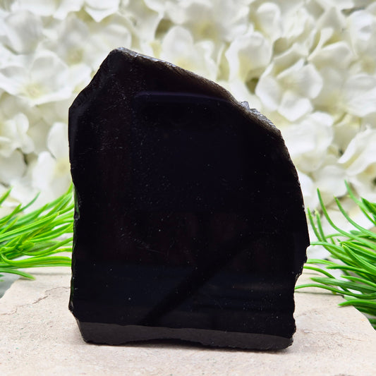 Natural black obsidian freeform from Mexico, known for its grounding presence and protective energy. A striking volcanic glass piece.