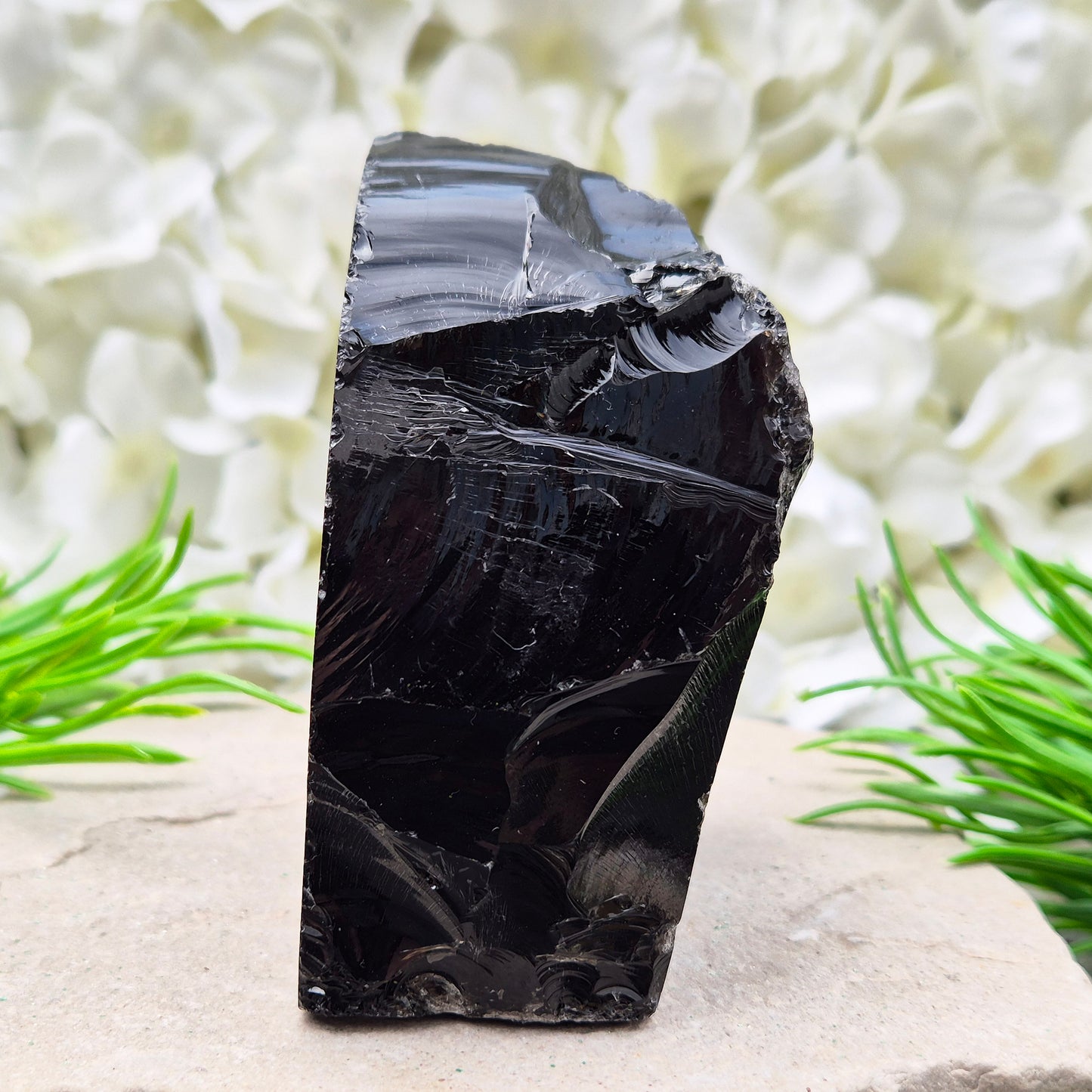Natural black obsidian freeform from Mexico, known for its grounding presence and protective energy. A striking volcanic glass piece.