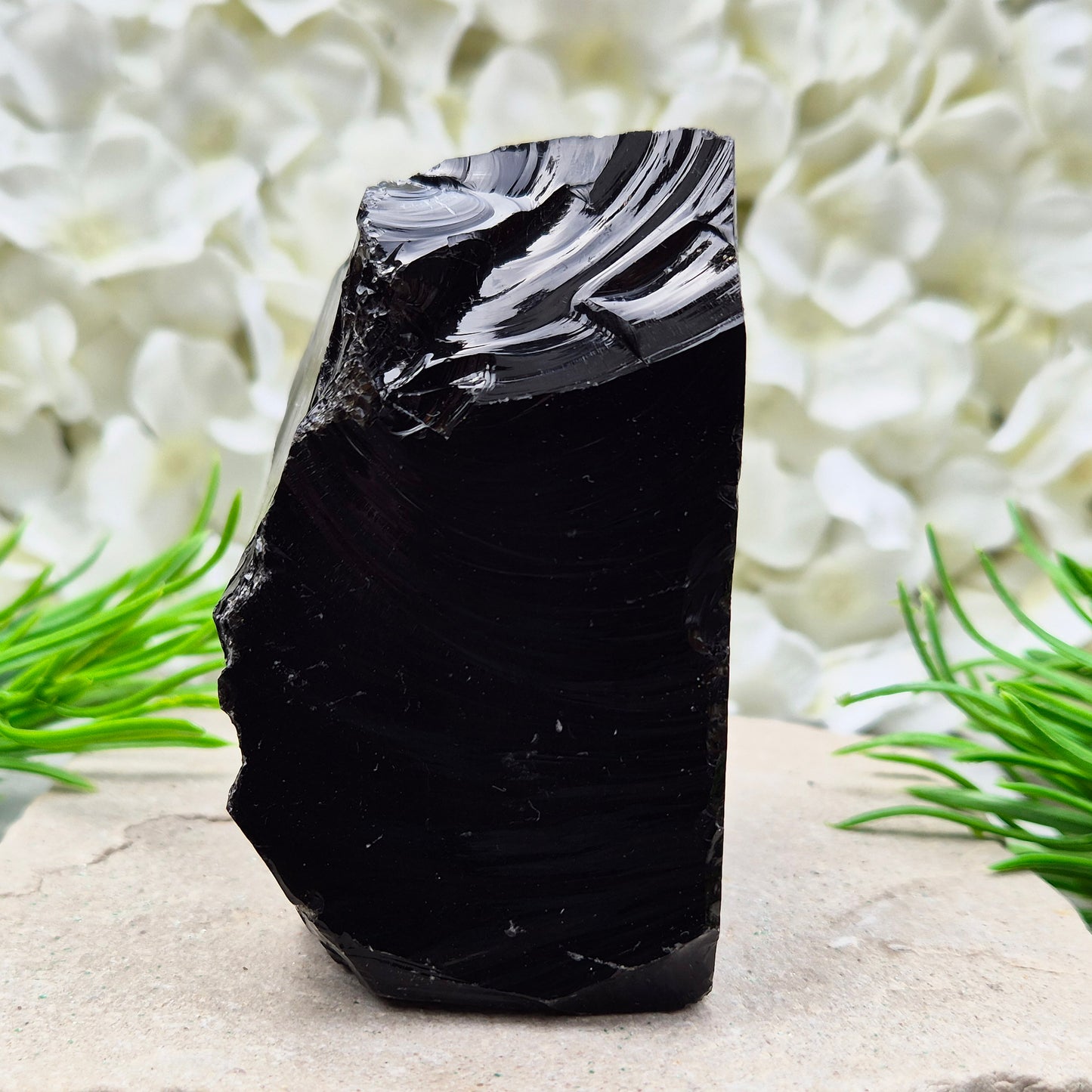 Natural black obsidian freeform from Mexico, known for its grounding presence and protective energy. A striking volcanic glass piece.