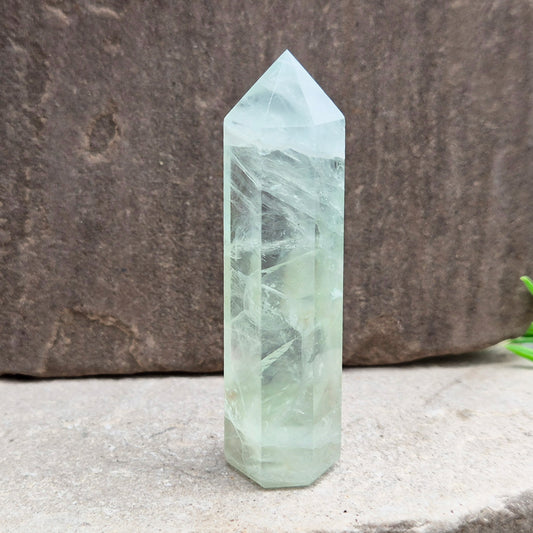 Natural Green Fluorite tower with six-sided generator tip. Supports focus, balance, and mental clarity. A calming crystal for your space or collection. UK home decor.