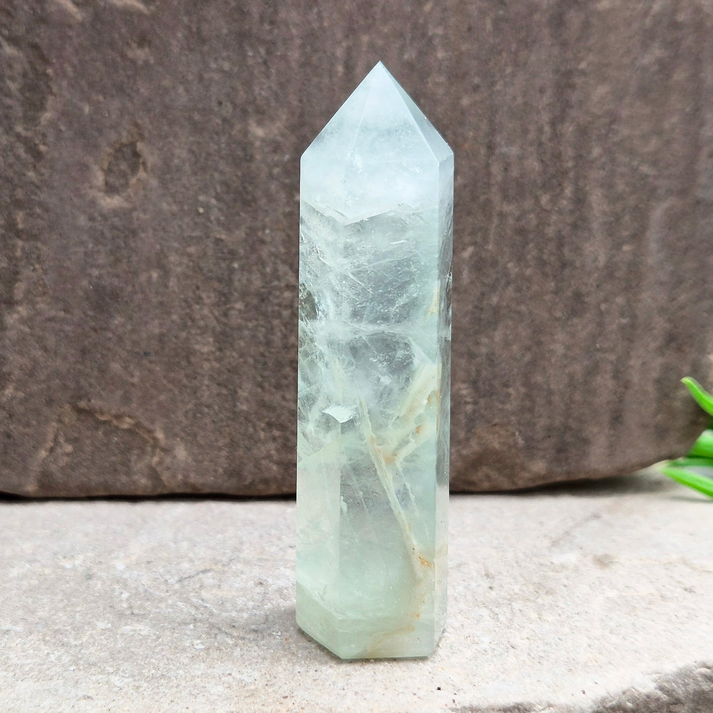 Natural Green Fluorite tower with six-sided generator tip. Supports focus, balance, and mental clarity. A calming crystal for your space or collection. UK home decor.