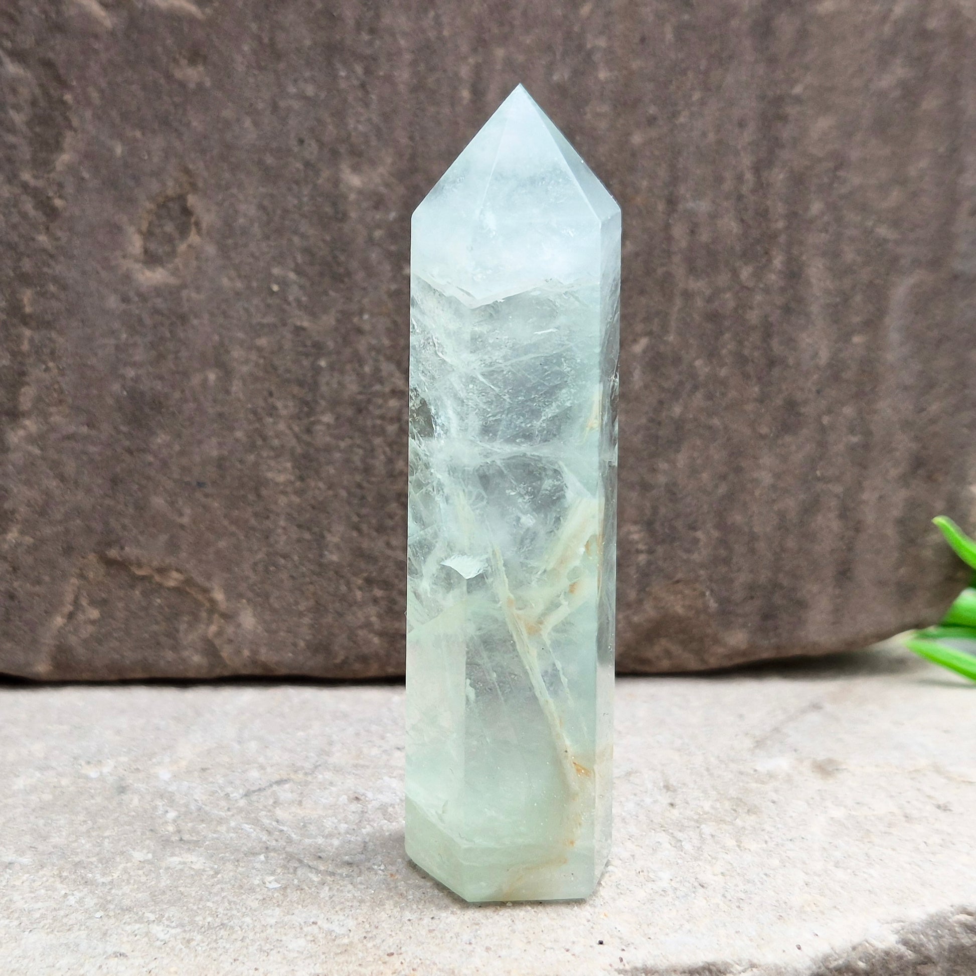 Natural Green Fluorite tower with six-sided generator tip. Supports focus, balance, and mental clarity. A calming crystal for your space or collection. UK home decor.
