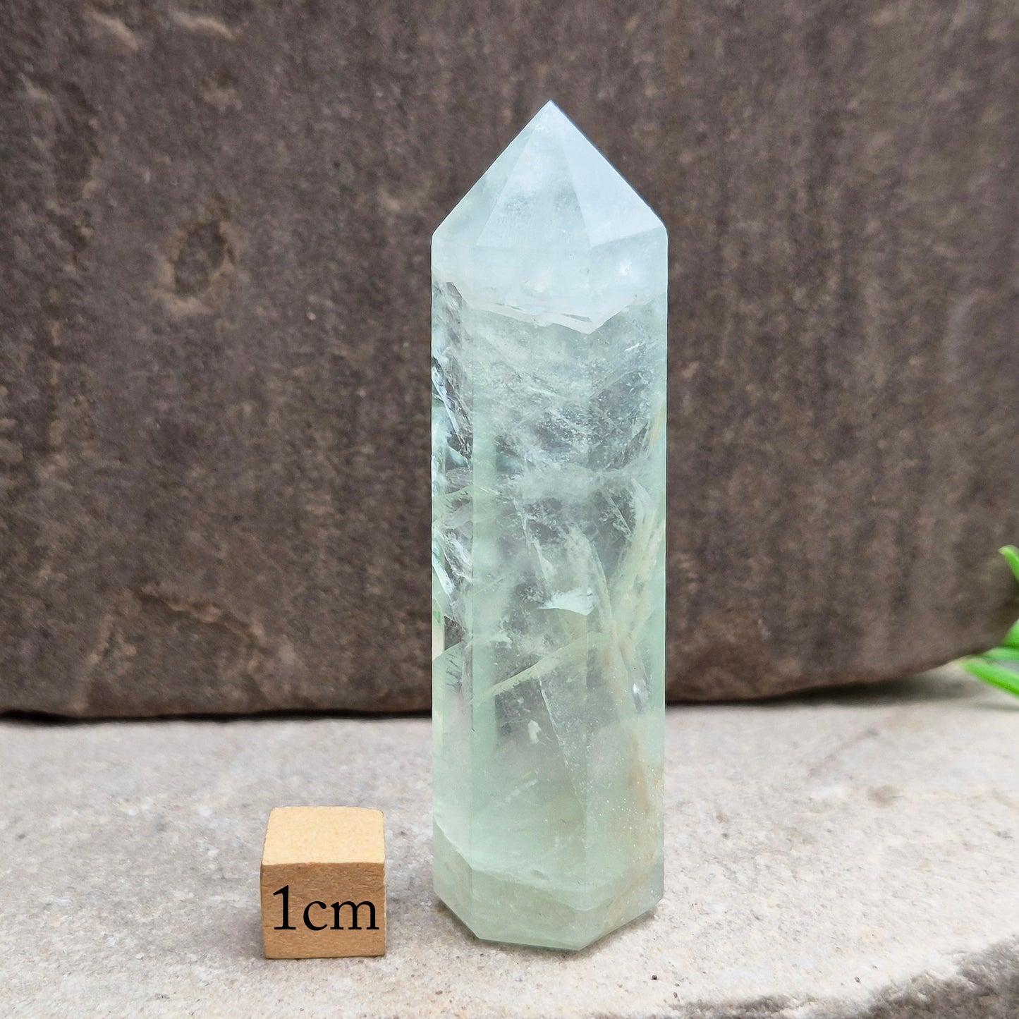 Natural Green Fluorite tower with six-sided generator tip. Supports focus, balance, and mental clarity. A calming crystal for your space or collection. UK home decor.