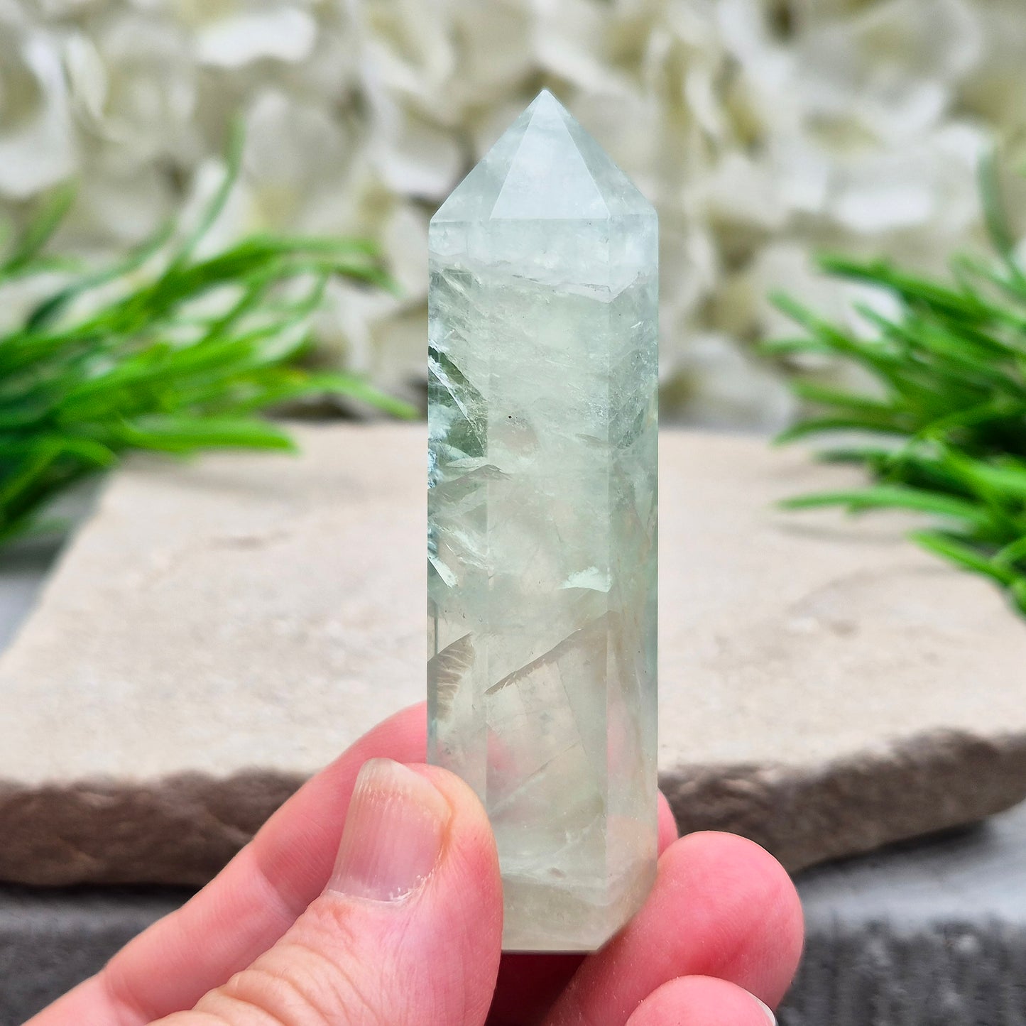 Natural Green Fluorite tower with six-sided generator tip. Supports focus, balance, and mental clarity. A calming crystal for your space or collection. UK home decor.