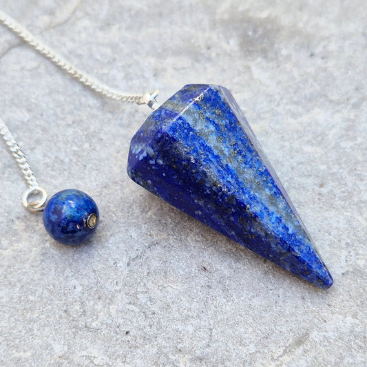 lapis lazuli pendulum for dowsing and intuitive work. A striking blue crystal used for guidance, insight, and energy balancing practices.