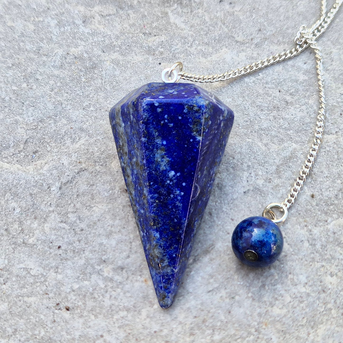 lapis lazuli pendulum for dowsing and intuitive work. A striking blue crystal used for guidance, insight, and energy balancing practices.