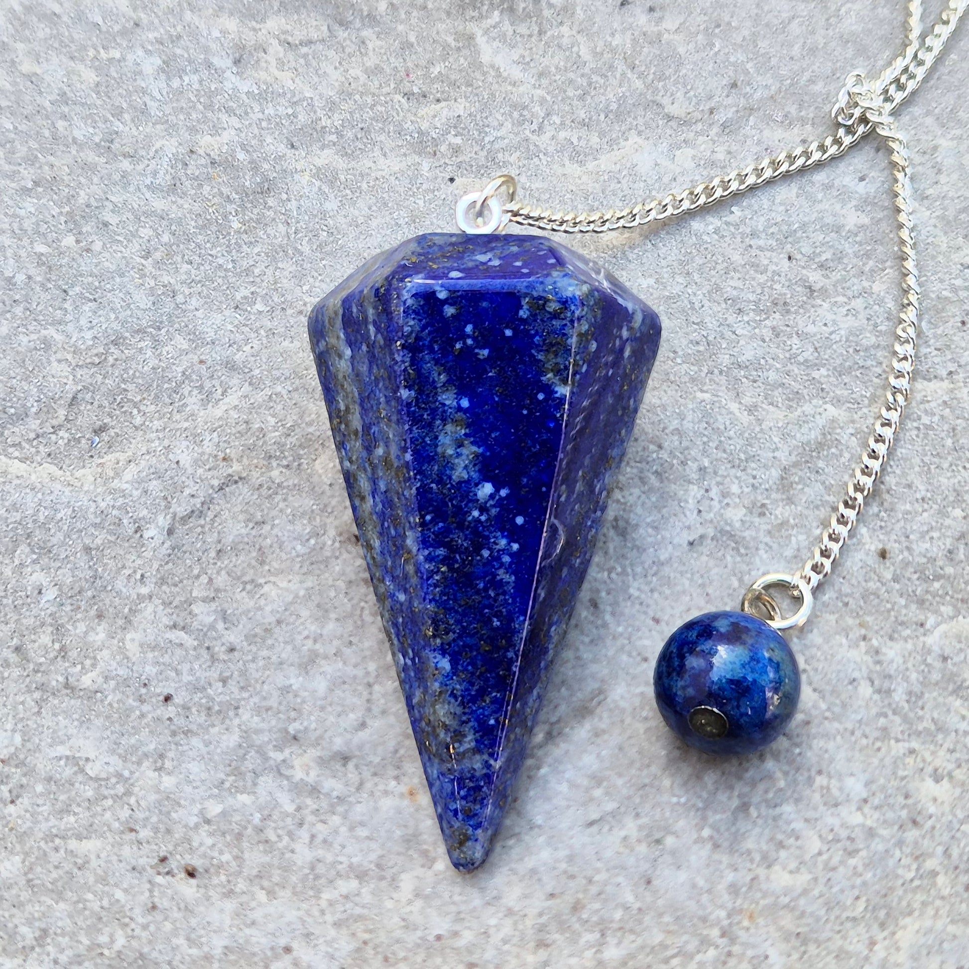 lapis lazuli pendulum for dowsing and intuitive work. A striking blue crystal used for guidance, insight, and energy balancing practices.