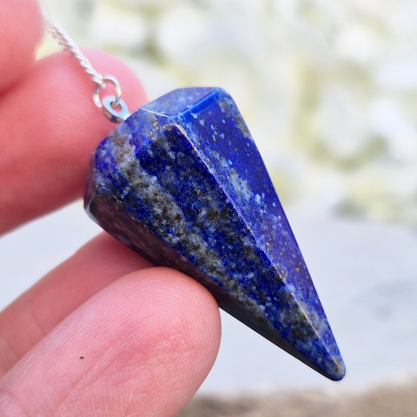 lapis lazuli pendulum for dowsing and intuitive work. A striking blue crystal used for guidance, insight, and energy balancing practices.