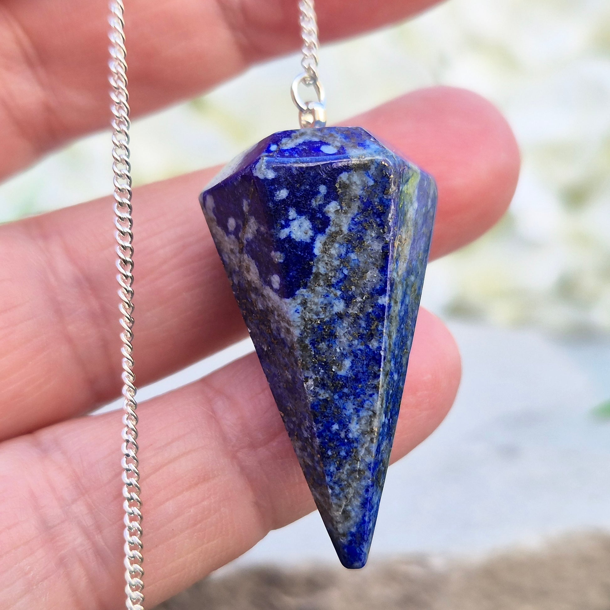 lapis lazuli pendulum for dowsing and intuitive work. A striking blue crystal used for guidance, insight, and energy balancing practices.