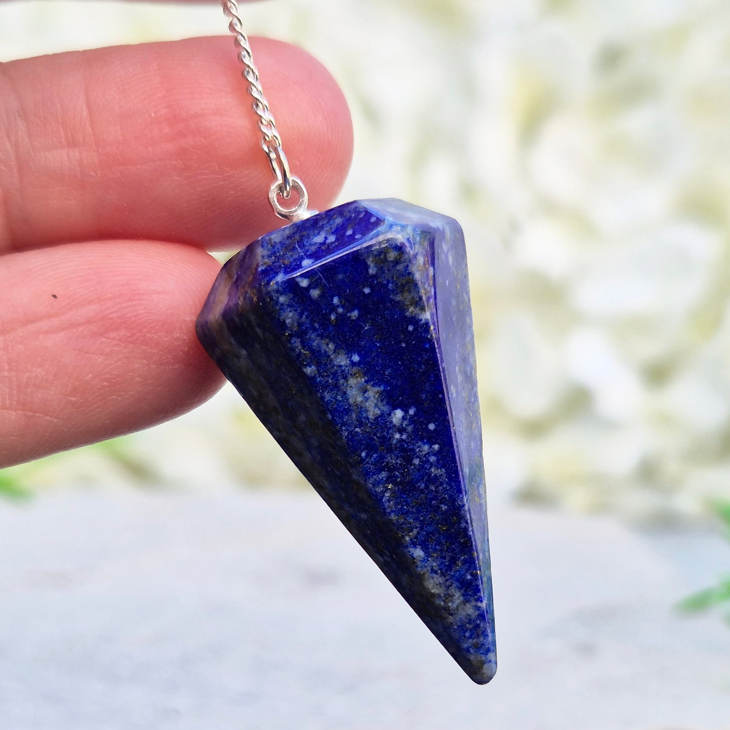lapis lazuli pendulum for dowsing and intuitive work. A striking blue crystal used for guidance, insight, and energy balancing practices.