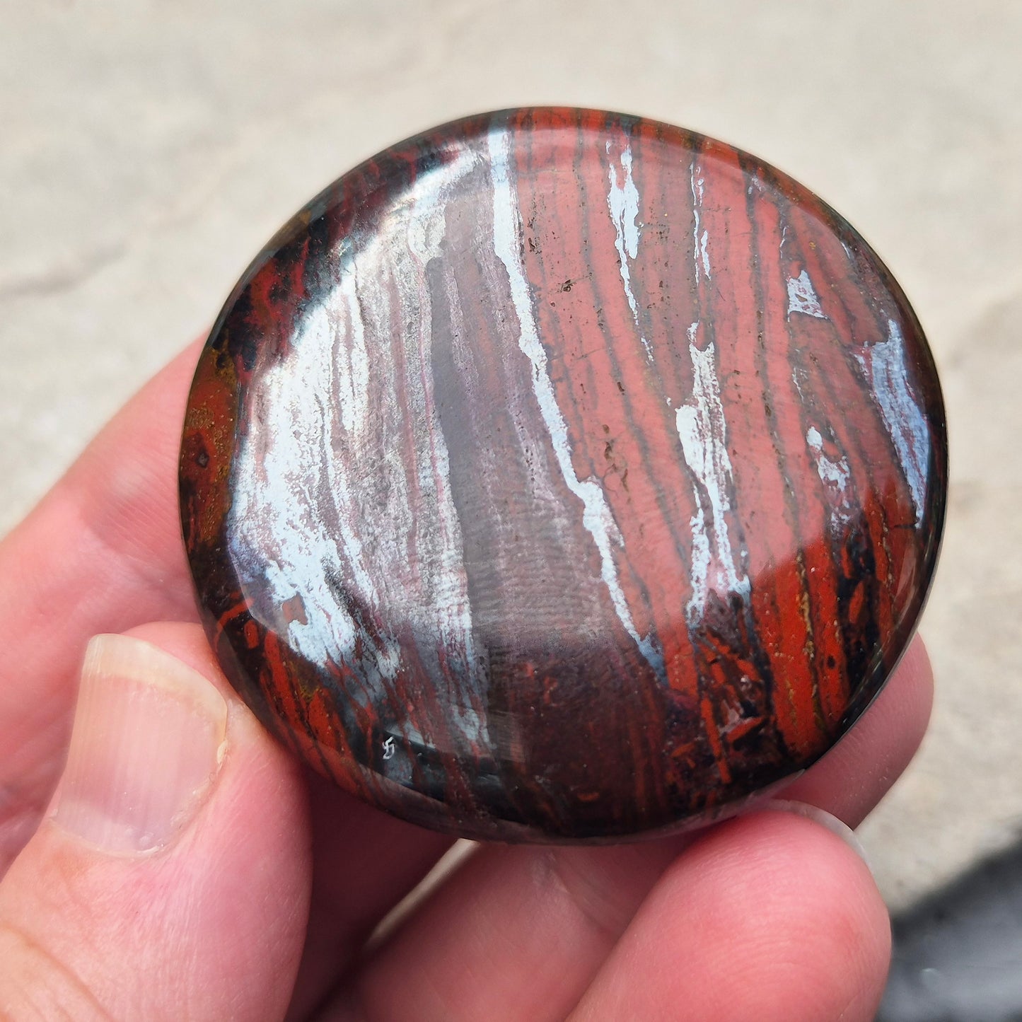 Composite Mugglestone palm stone combining Tiger Eye, Hematite & Red Jasper. Grounding, protective energy supporting focus, strength, and balance.
