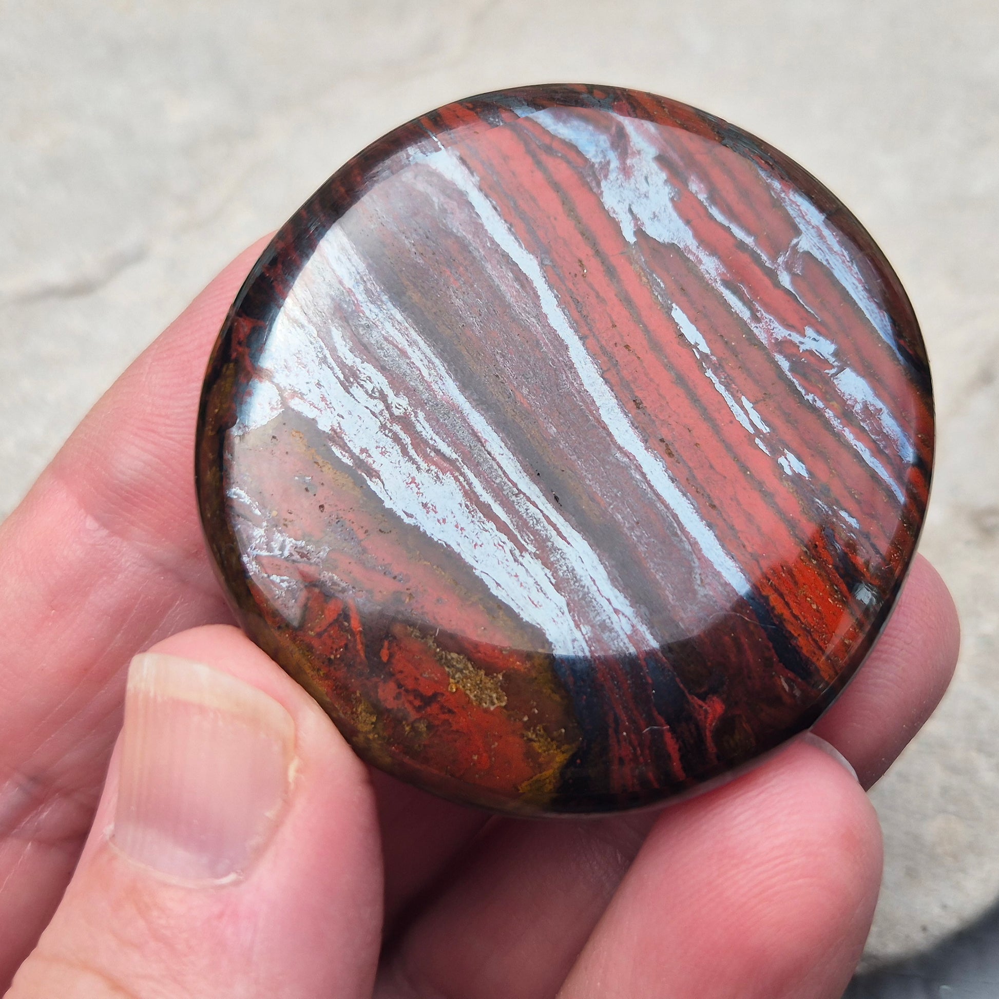 Composite Mugglestone palm stone combining Tiger Eye, Hematite & Red Jasper. Grounding, protective energy supporting focus, strength, and balance.