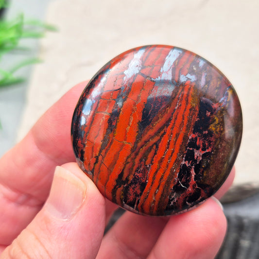 Composite Mugglestone palm stone combining Tiger Eye, Hematite & Red Jasper. Grounding, protective energy supporting focus, strength, and balance.