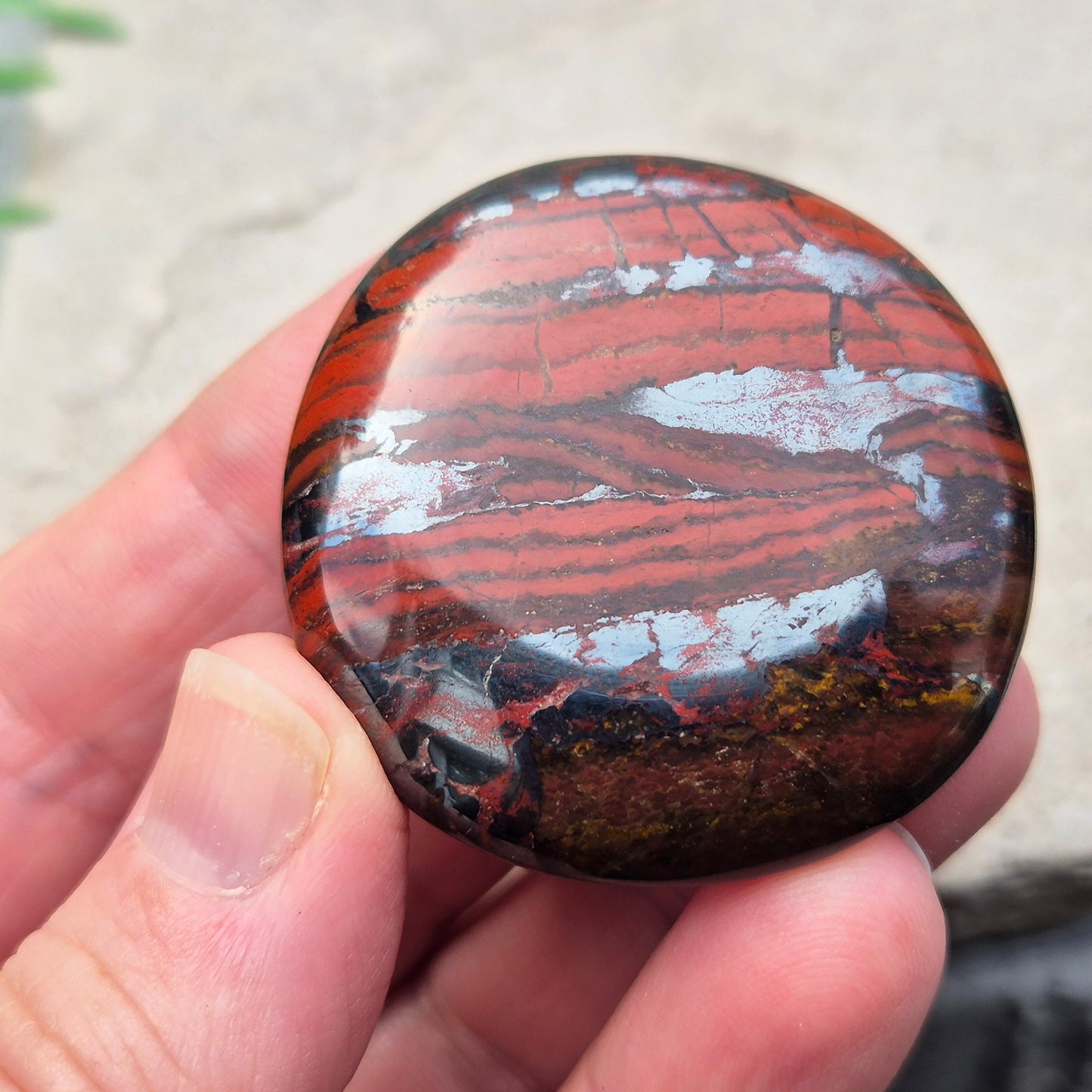 Composite Mugglestone palm stone combining Tiger Eye, Hematite & Red Jasper. Grounding, protective energy supporting focus, strength, and balance.