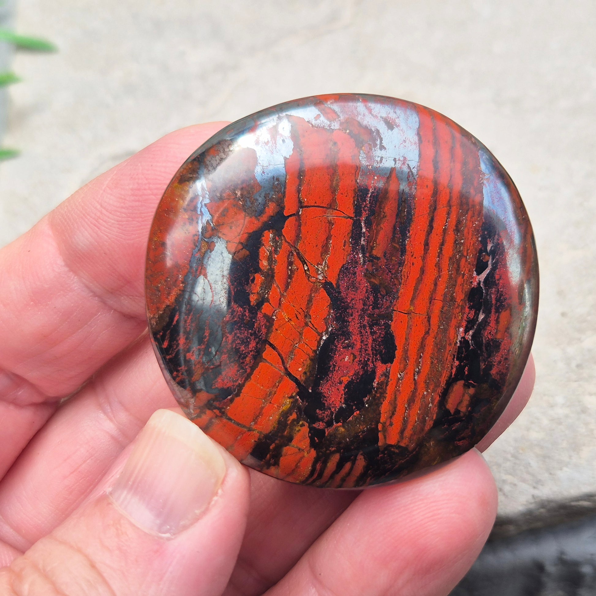 Composite Mugglestone palm stone combining Tiger Eye, Hematite & Red Jasper. Grounding, protective energy supporting focus, strength, and balance.