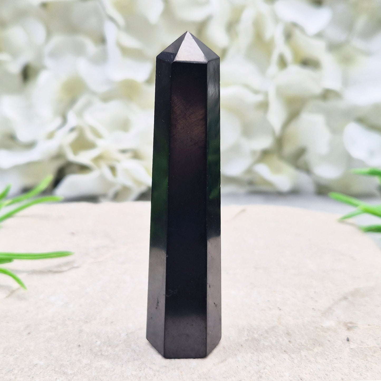 Polished Shungite Crystal Tower from Karelia, Russia. A grounding and protective crystal point ideal for meditation, energy work, and calm spaces.