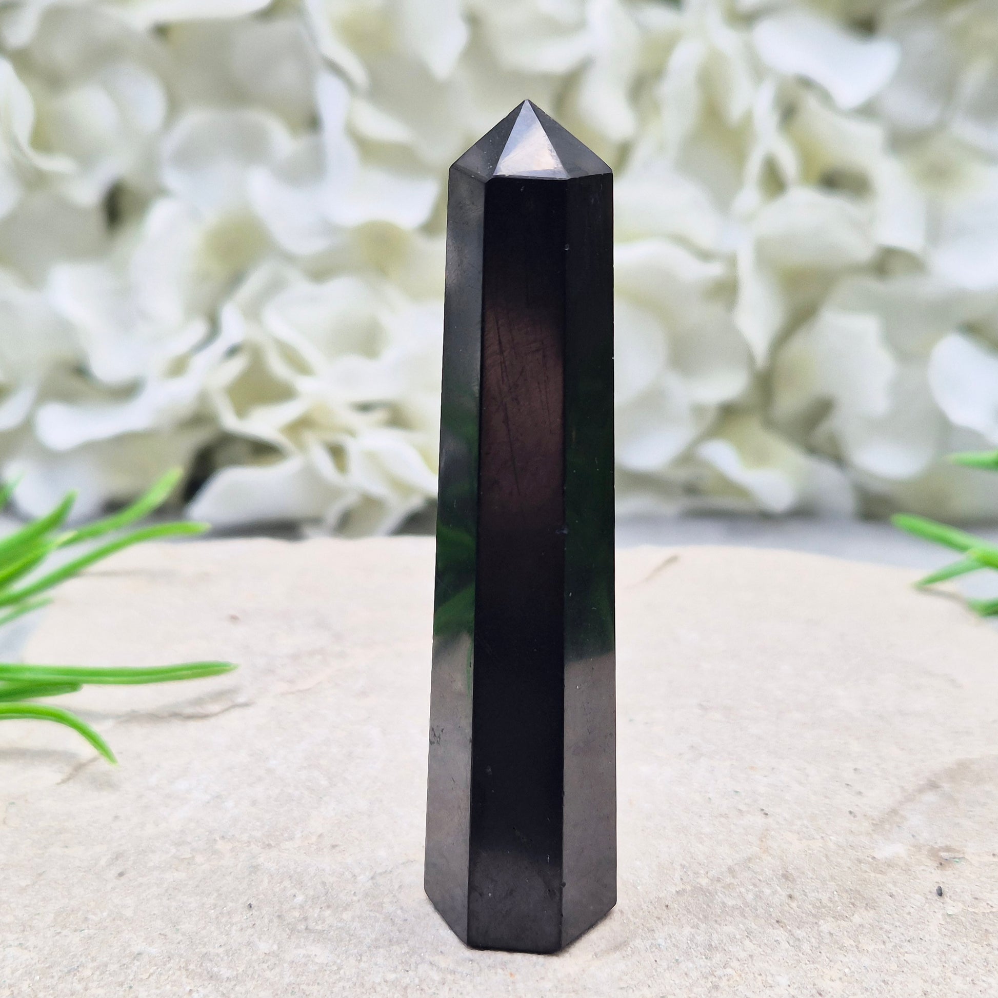 Polished Shungite Crystal Tower from Karelia, Russia. A grounding and protective crystal point ideal for meditation, energy work, and calm spaces.