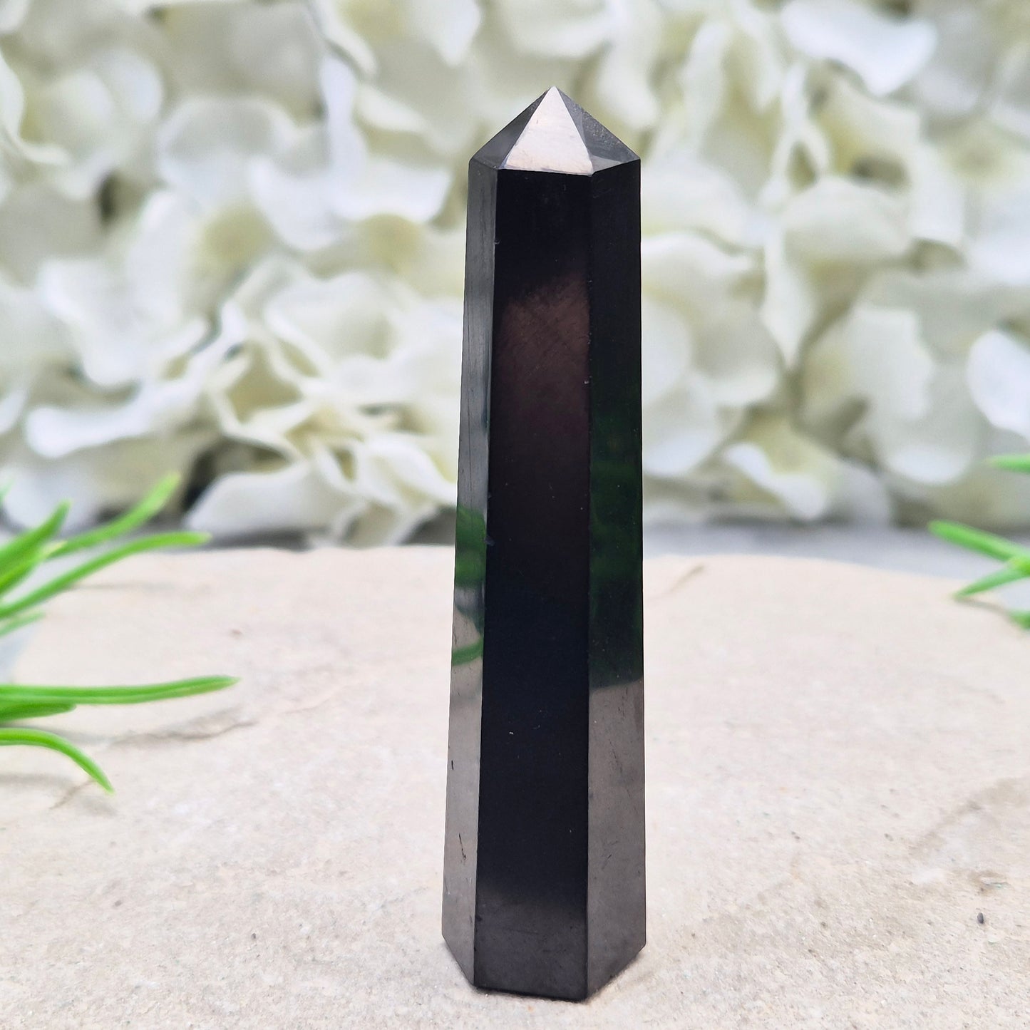 Polished Shungite Crystal Tower from Karelia, Russia. A grounding and protective crystal point ideal for meditation, energy work, and calm spaces.