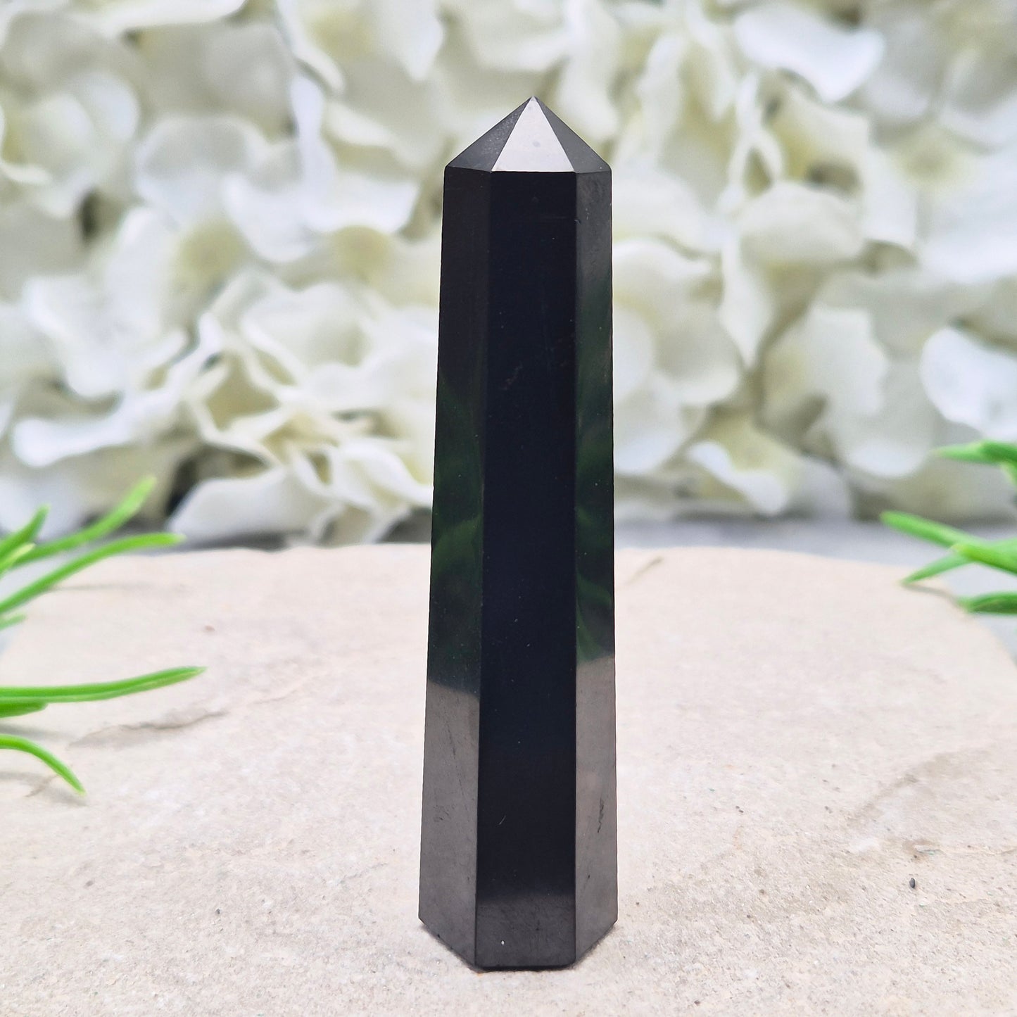 Polished Shungite Crystal Tower from Karelia, Russia. A grounding and protective crystal point ideal for meditation, energy work, and calm spaces.