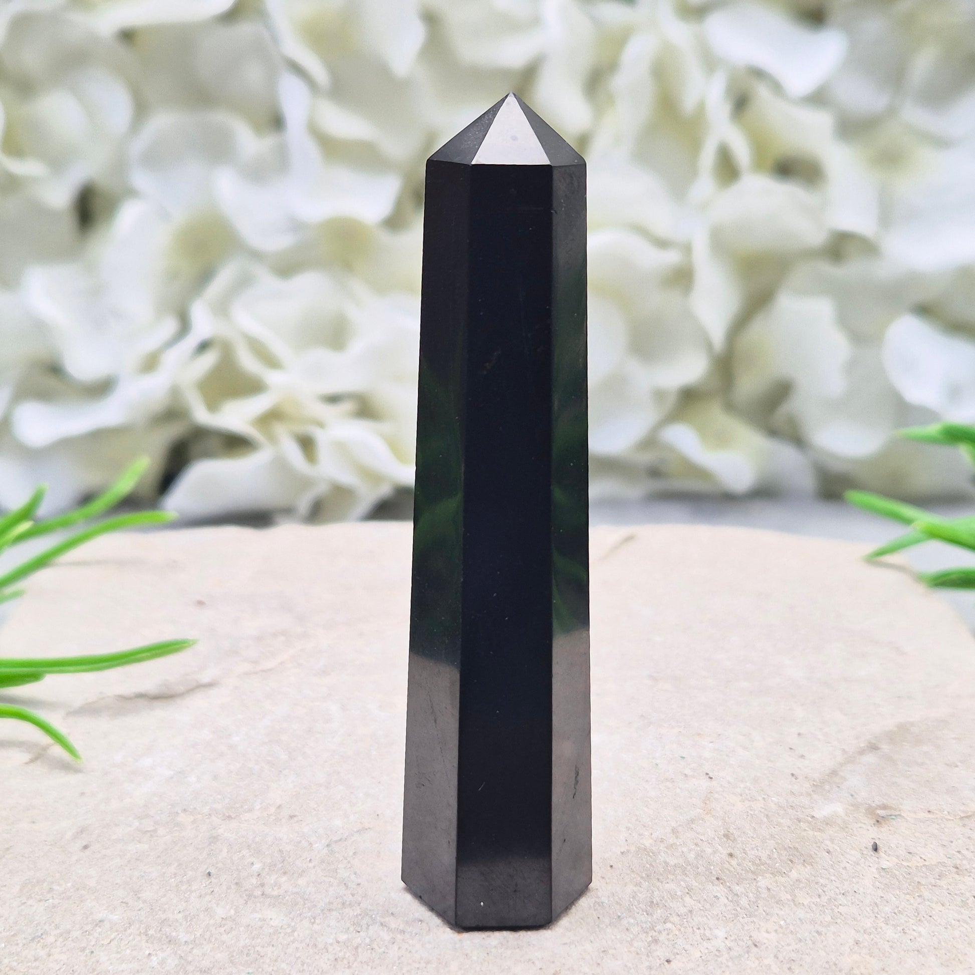 Polished Shungite Crystal Tower from Karelia, Russia. A grounding and protective crystal point ideal for meditation, energy work, and calm spaces.