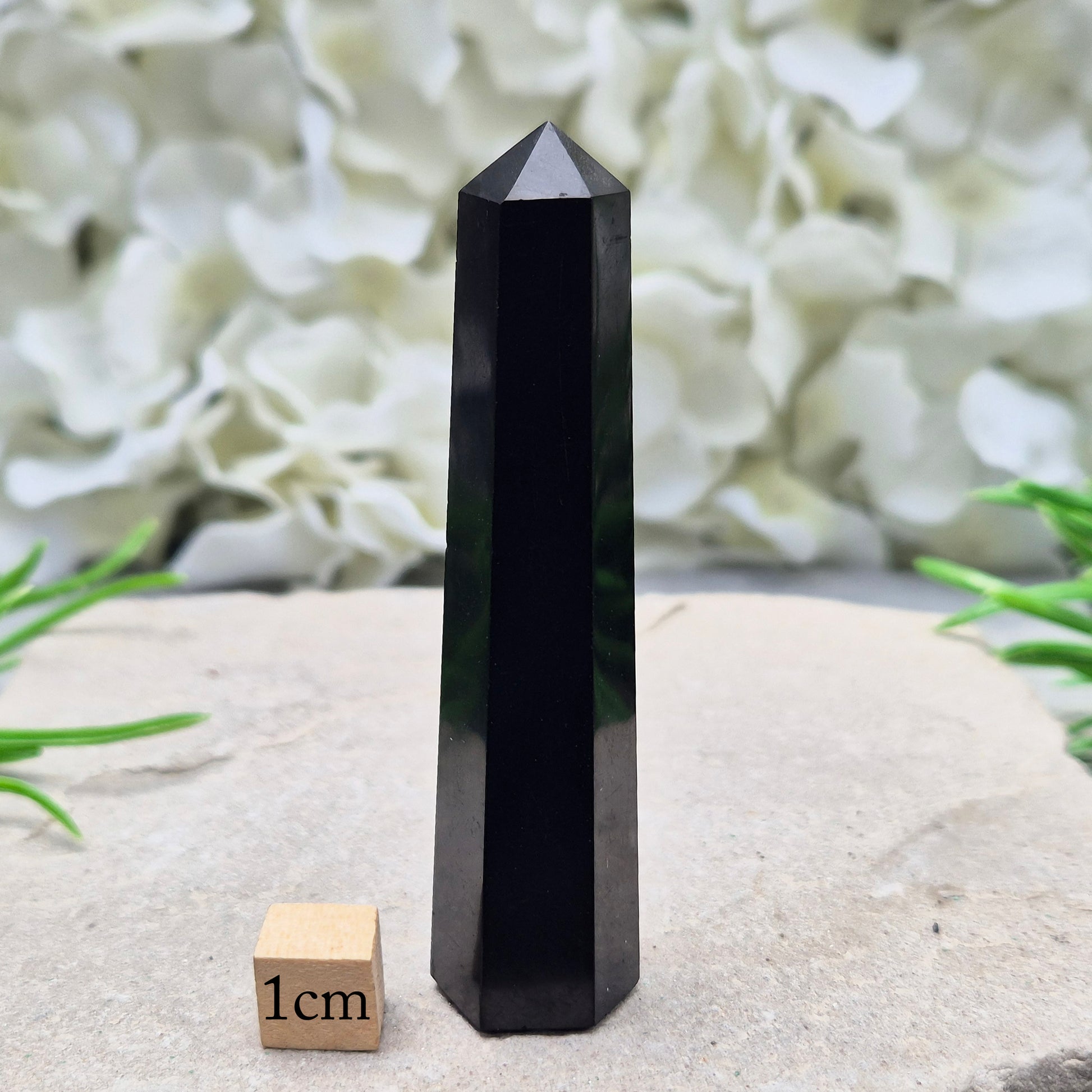 Polished Shungite Crystal Tower from Karelia, Russia. A grounding and protective crystal point ideal for meditation, energy work, and calm spaces.