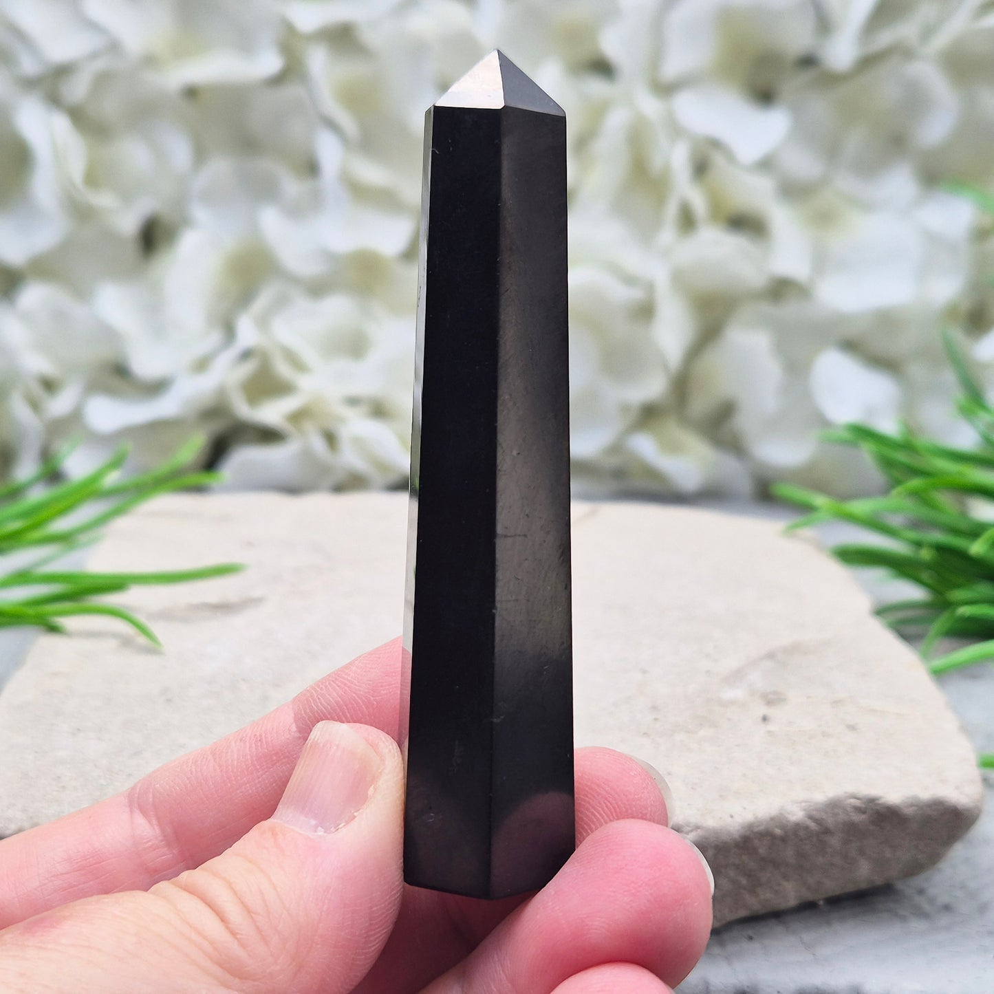 Polished Shungite Crystal Tower from Karelia, Russia. A grounding and protective crystal point ideal for meditation, energy work, and calm spaces.
