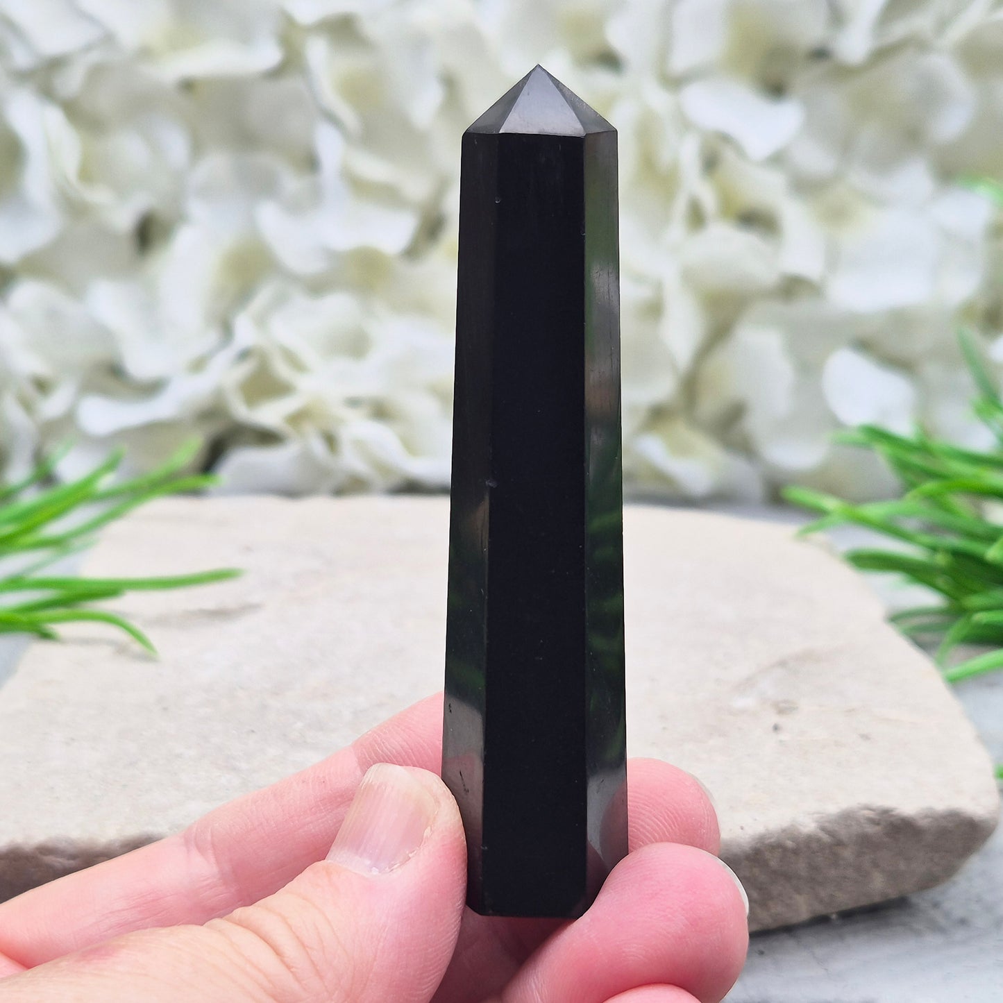 Polished Shungite Crystal Tower from Karelia, Russia. A grounding and protective crystal point ideal for meditation, energy work, and calm spaces.